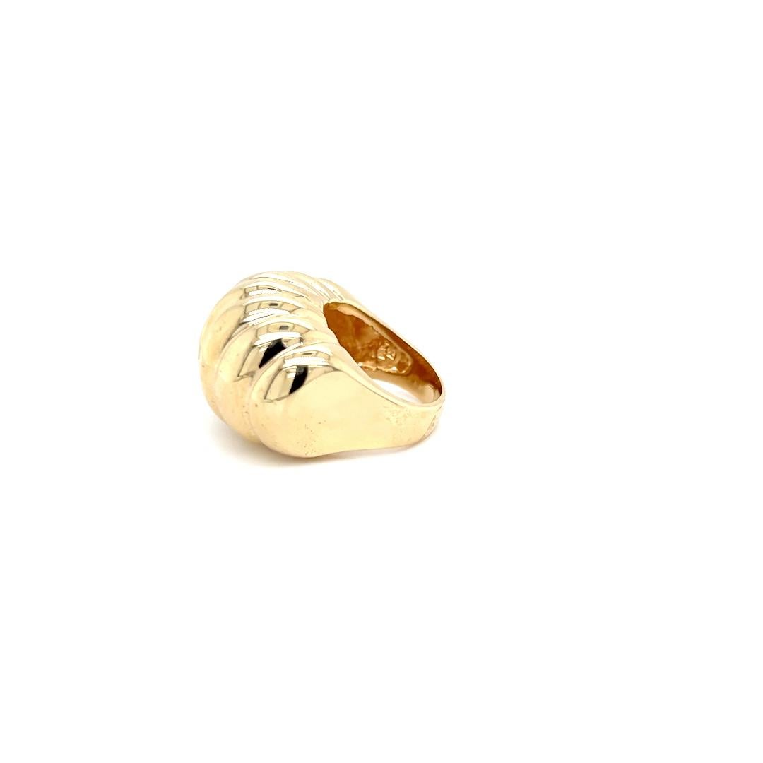 One 14 karat yellow gold scalloped dome ring, stamped 