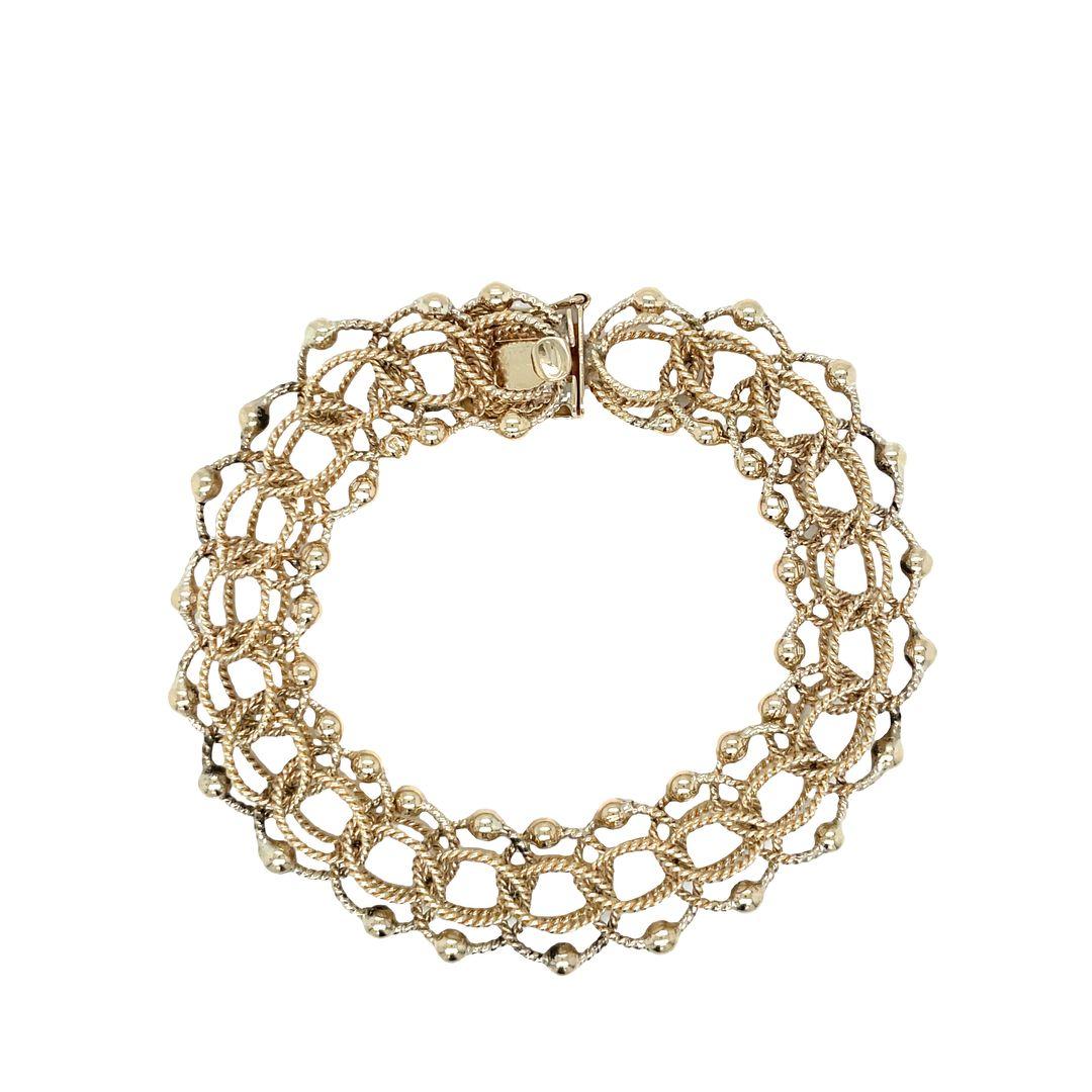 This is a stunning retro gold bracelet with intricate detailing! The links are twisted rope round shapes, interlocking to form a strong and fluid chain. The addition of decorative gold beads adds to its lovely profile. A locking clasp ensures a