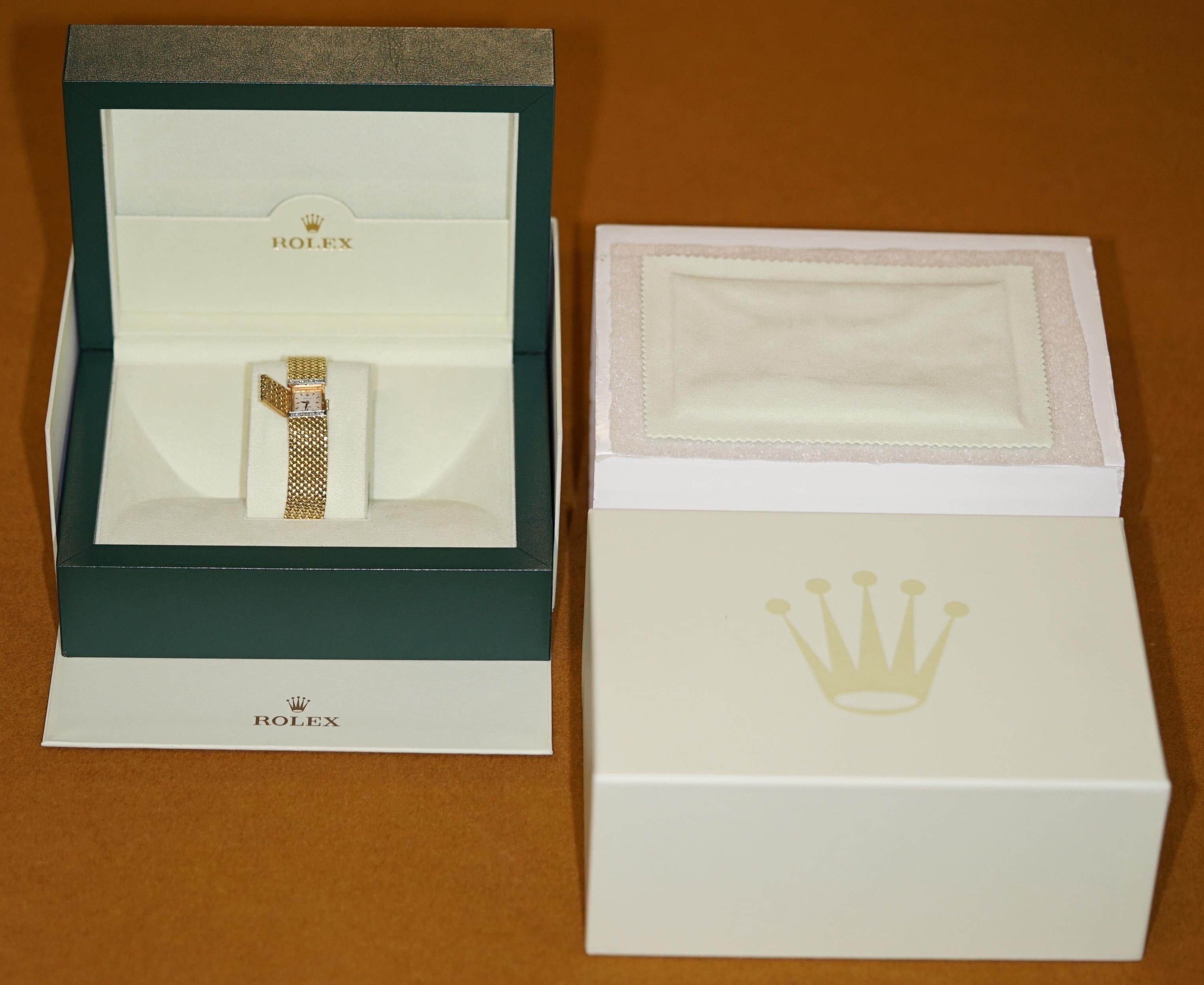 We are delighted to offer for sale this very rare solid 18-carat gold ladies Rolex Precision wristwatch mesh bracelet with diamonds.

A truly stunning piece, it wears like a normal seriously luxury bracelet as the watch face has a cover, open the