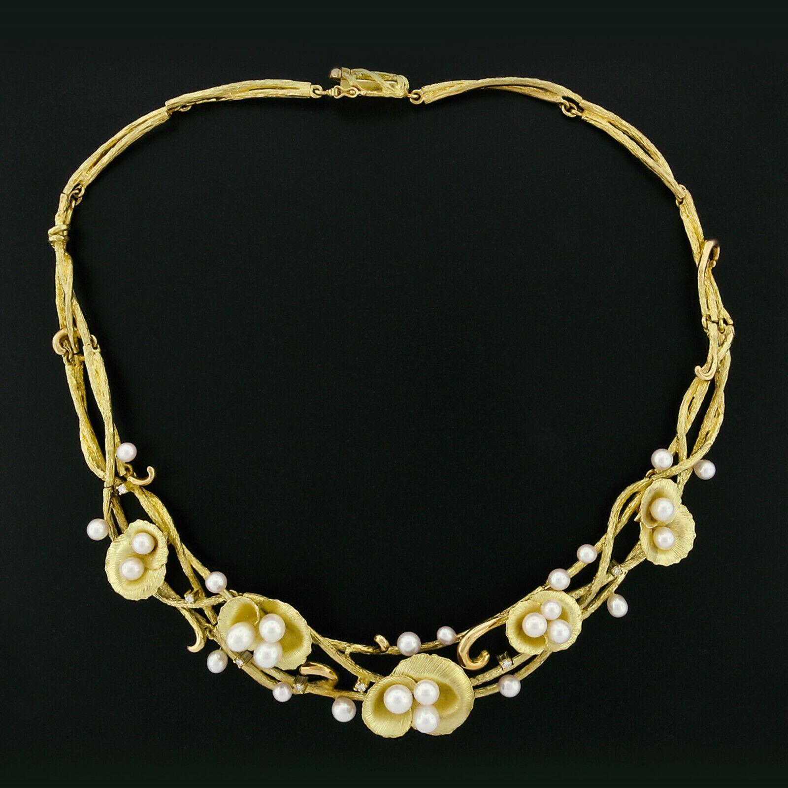 This outstanding statement collier necklace is very finely crafted in solid 18k yellow gold and features uniquely textured branch like links, decorated with beautifully patterned open flowers. The pearls are truly very fine quality pearls offering