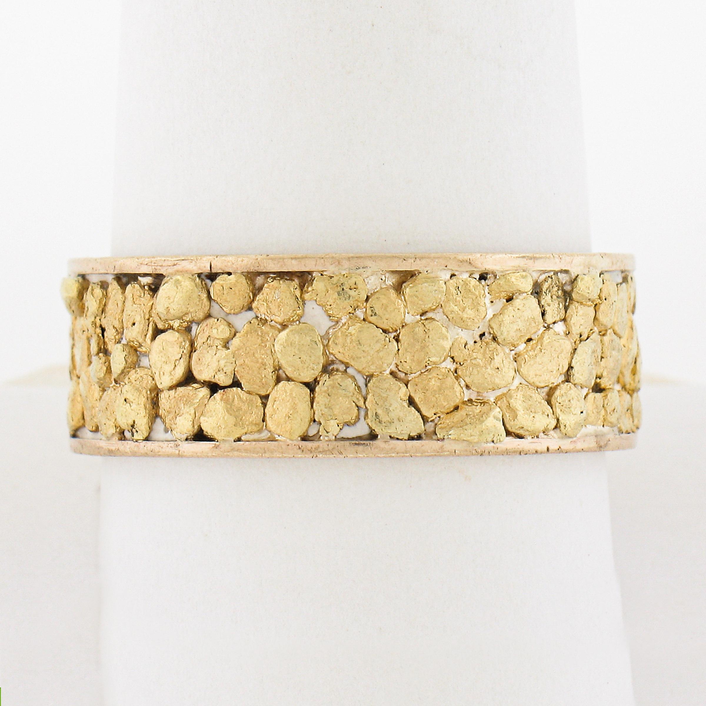 These are actual nuggets on the band and have some of the stone in between. They test 18k+ the nuggets. Unique band! Enjoy!

Material: Solid 18k Yellow Gold  
Weight: 8.59 Grams
Ring Size: 10.5 (We CANNOT custom size this ring.)
Ring Width: 7.9mm