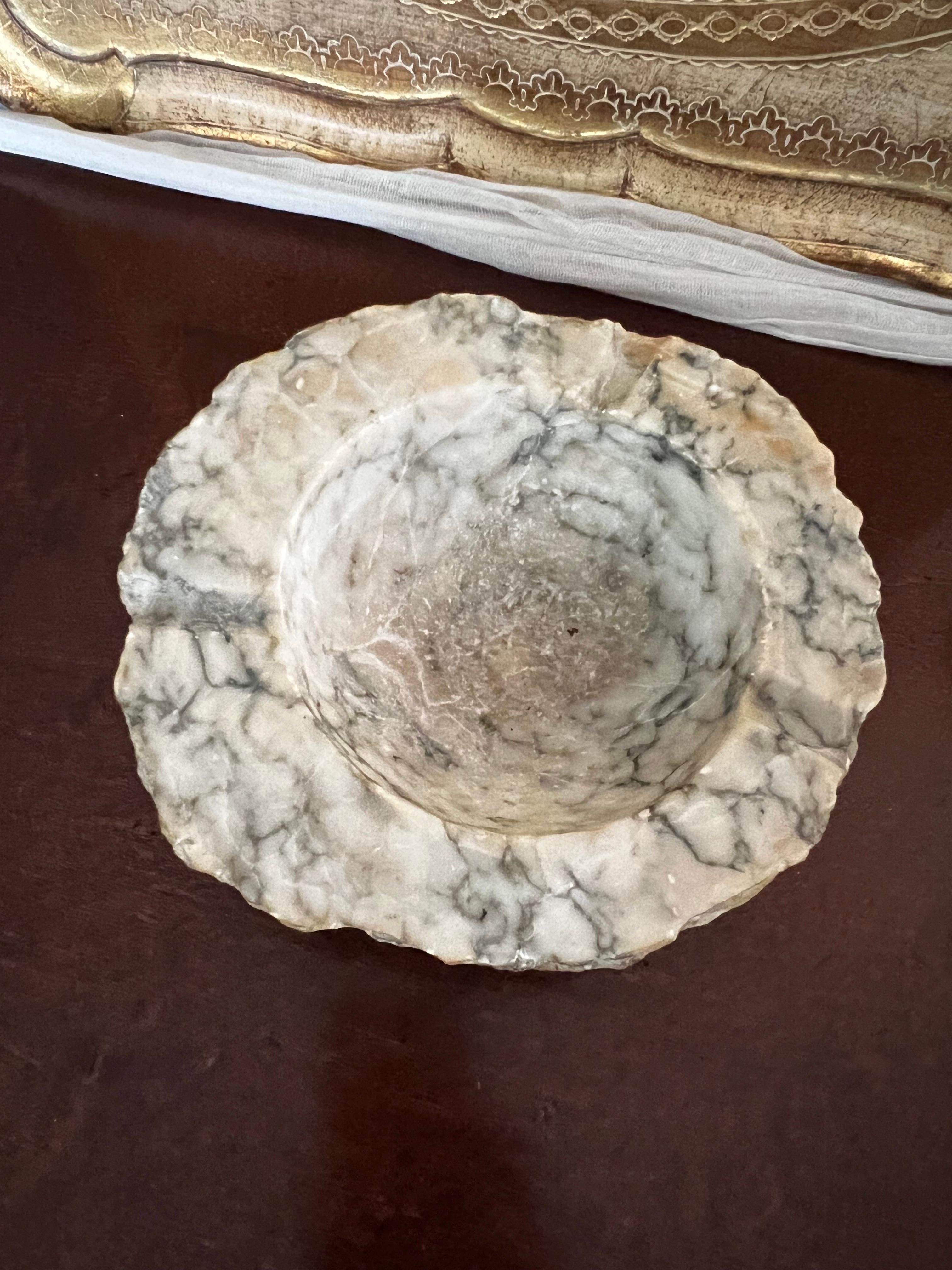 This amazing true Mid Century piece is not only an ashtray but a piece of art, hand carved from a block of alabaster marble in Italy this could be use for its original purpose or a catch all bowl in an entrance table, for small collectibles in a