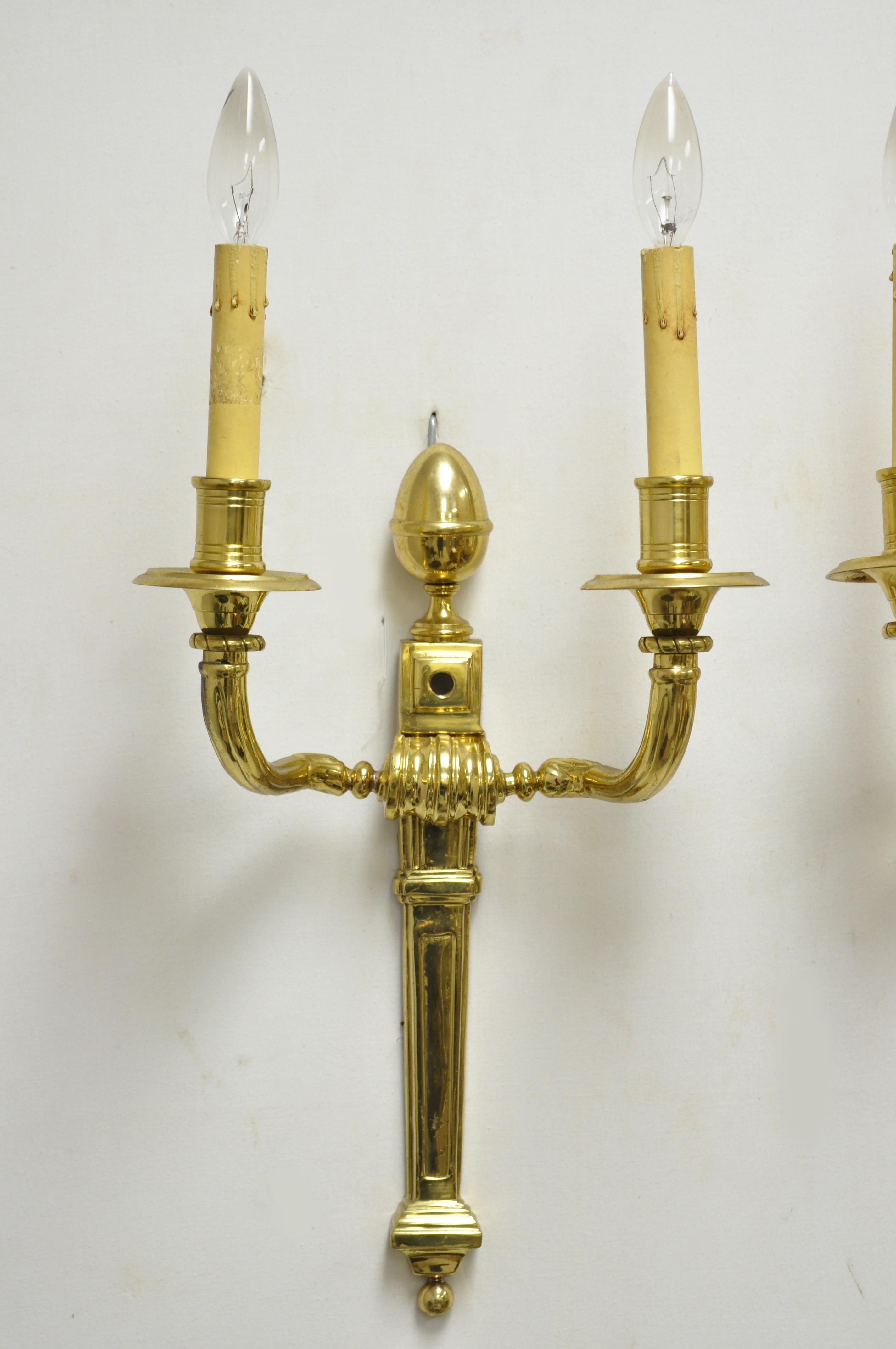 Vintage solid brass American Colonial Williamsburg lighted wall sconces - pair A, circa mid-late 20th century. Measurements: 21
