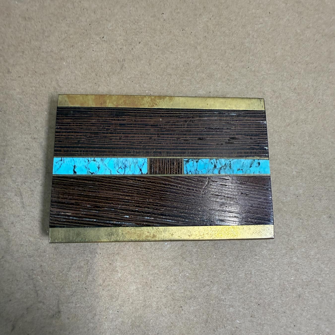 AMBIANIC presents
Vintage Solid Brass Belt Buckle Ebony and Turquoise
style of Kenneth Reid
2.75 x 1.88 x 3/16
Preowned original vintage condition unrestored
refer to images listed