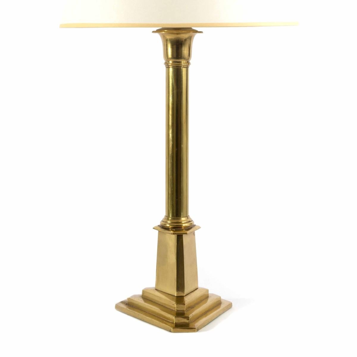 A vintage polished brass table lamp featuring a triangular-shaped base and custom shade, USA, circa 1970.
Wired for USA and UL listed; takes a standard base bulb, 100 watts max. 

The brass finish has a beautiful aged patina with some expected