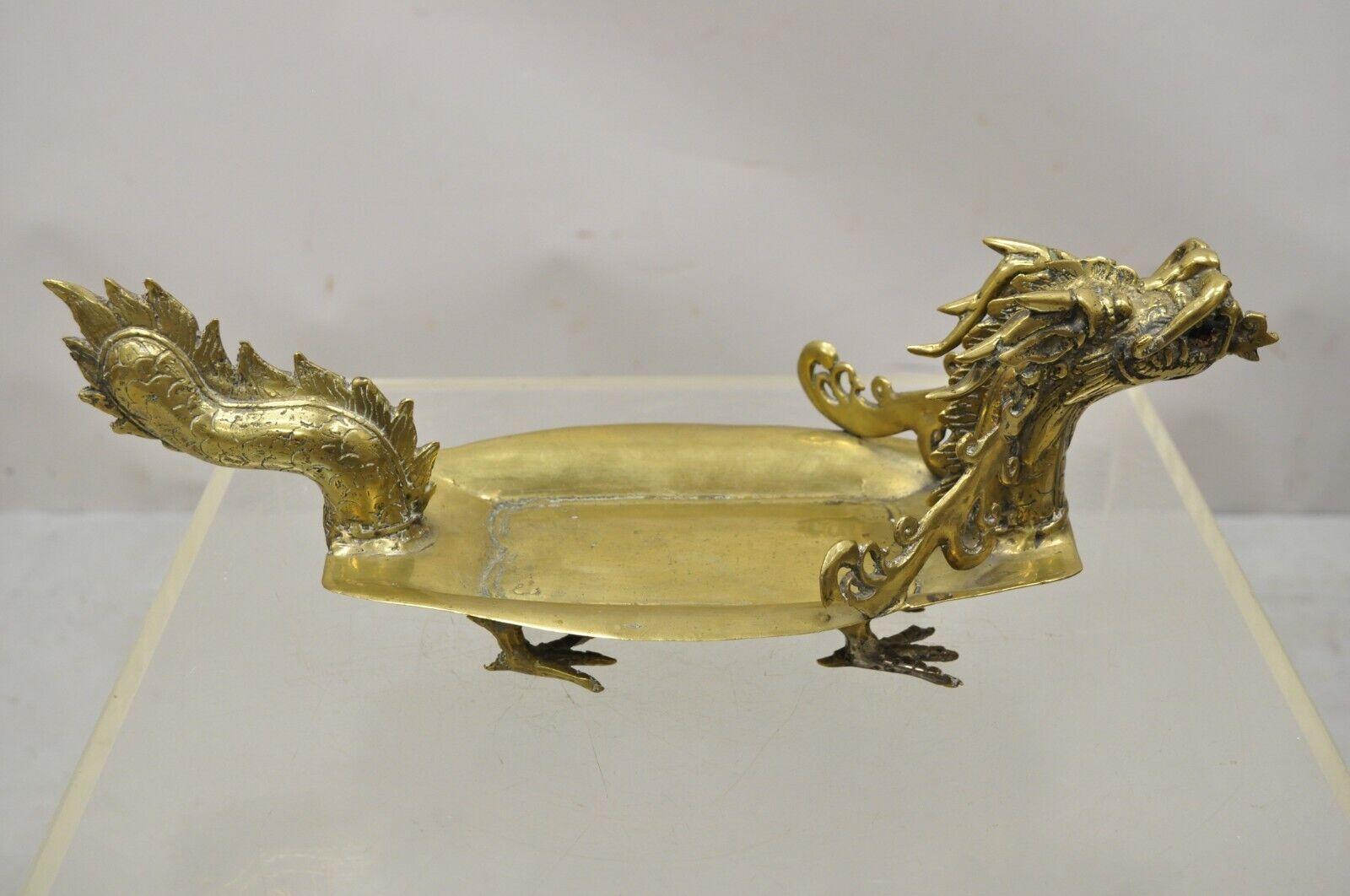 Vintage solid brass dragon form Chinese trinket dish desk accessory. Item featured is raised on feet, ornate detail, very nice vintage, great style and form. Circa Mid 20th Century. Measurements: 5.5