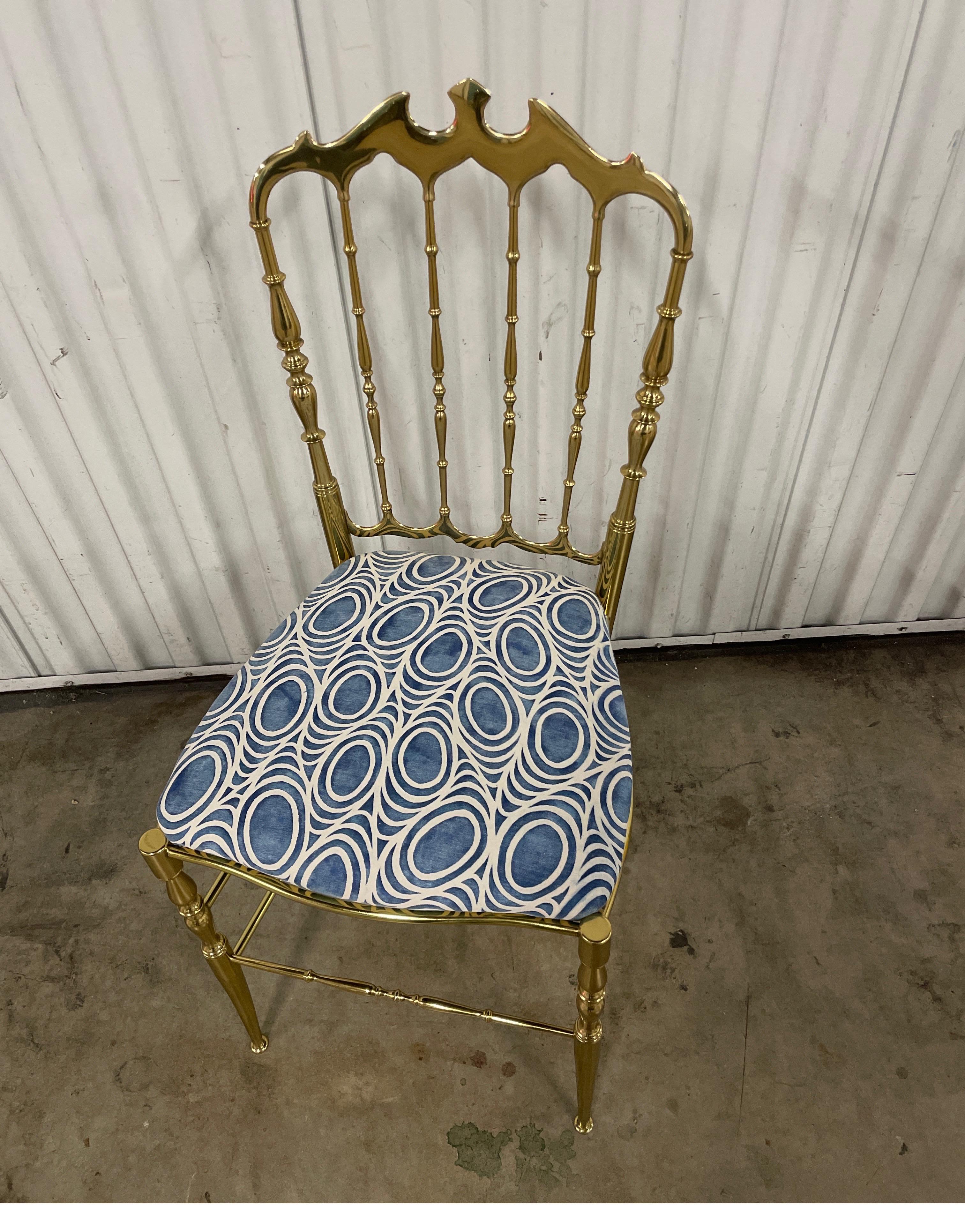 Vintage 1970's polished solid brass Chiavari chair with newly upholstered seat in Fortuny fabric.