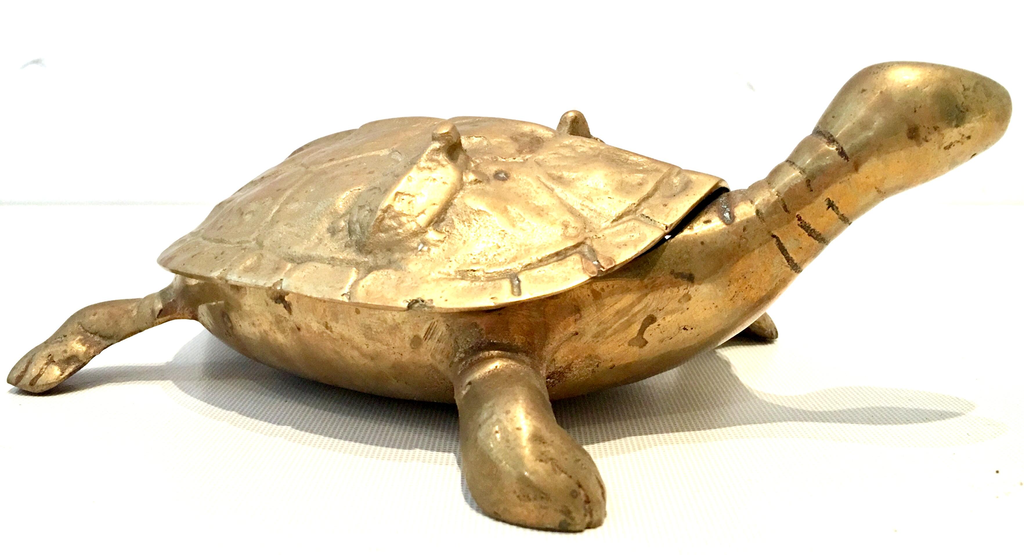 20th century solid brass large turtle lidded box. Features a Chinese symbol oh the interior bottom with great attention to detail and two abstract baby turtles on the top lid.