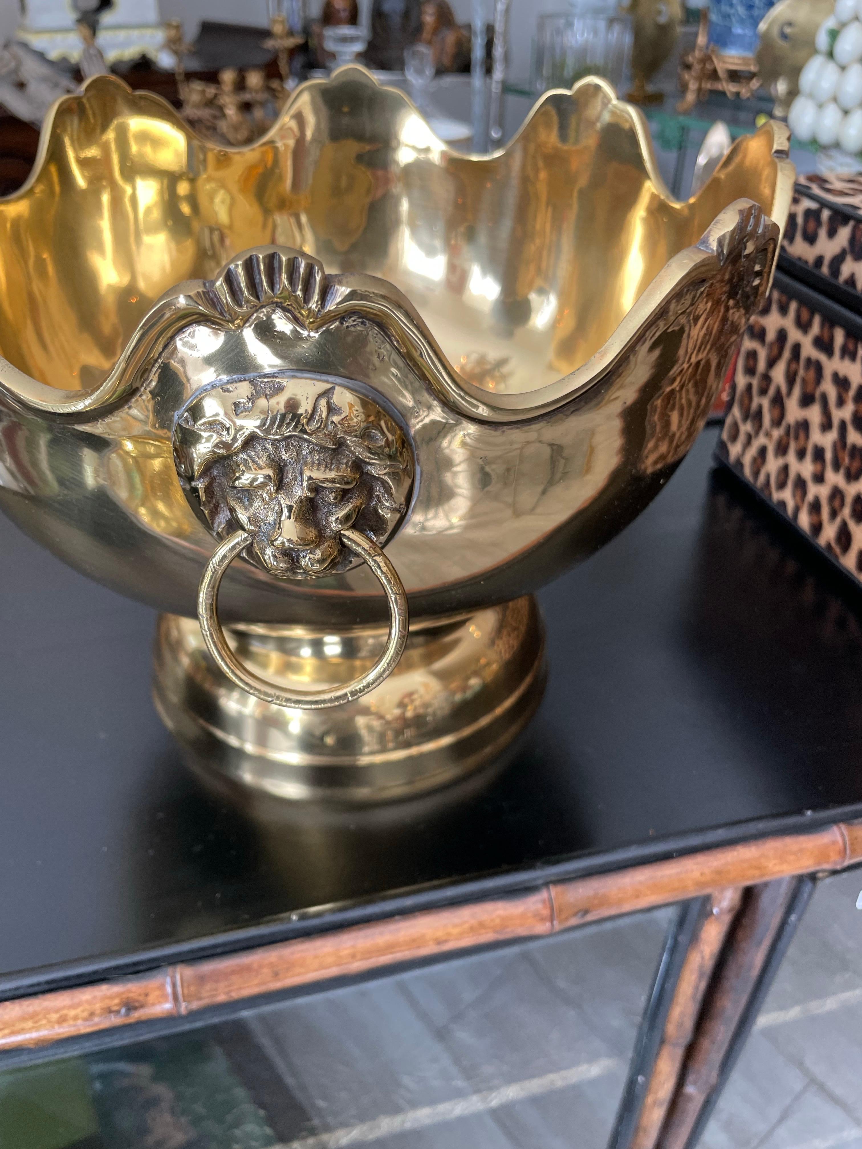 Vintage solid brass Monteith bowl with two lion head and ring handles. Nice scalloped top edge. 