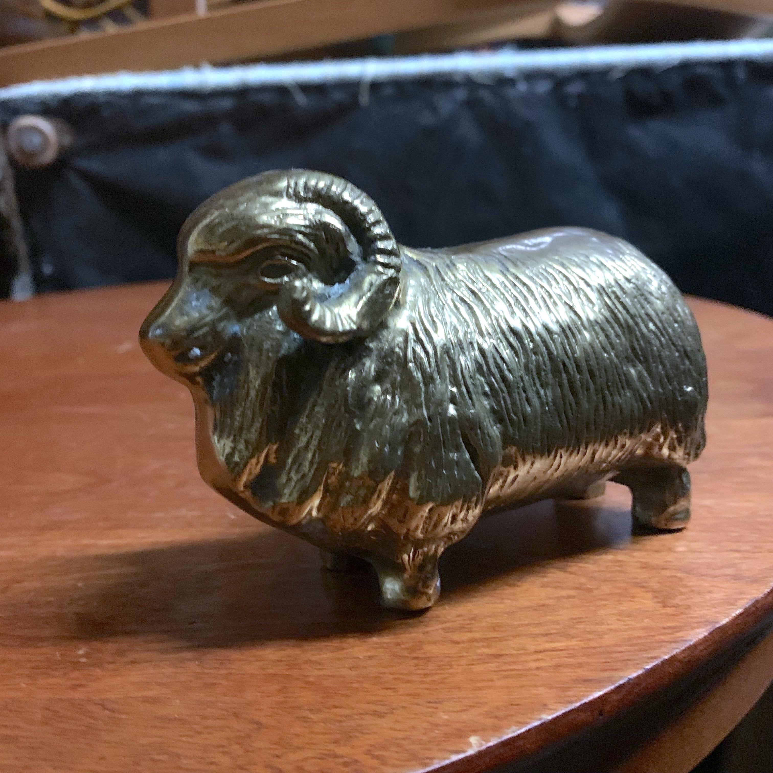 A handsome plump and squatting solid brass ram figure. Great for display and as a paperweight.
  