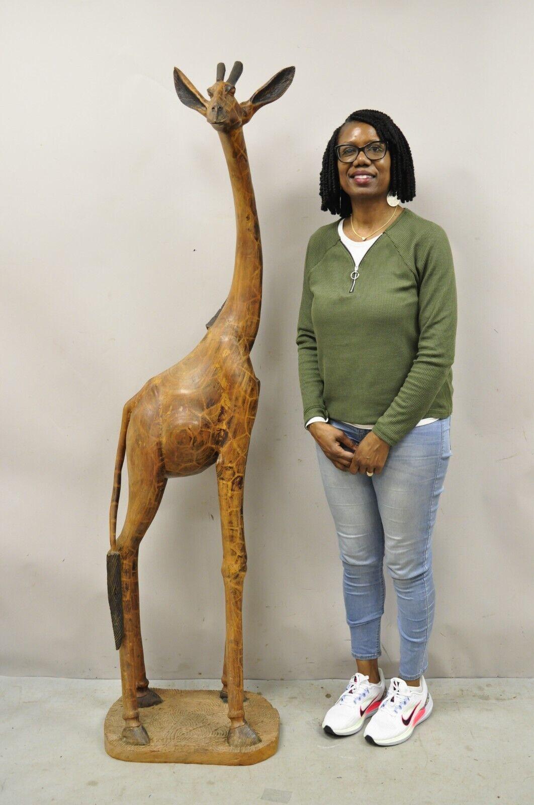 Vintage Solid Carved Wood 72” Tall African Safari Giraffe Statue Sculpture. Item features a heavy solid carved wood construction nicely carved details, large impressive size, signed 