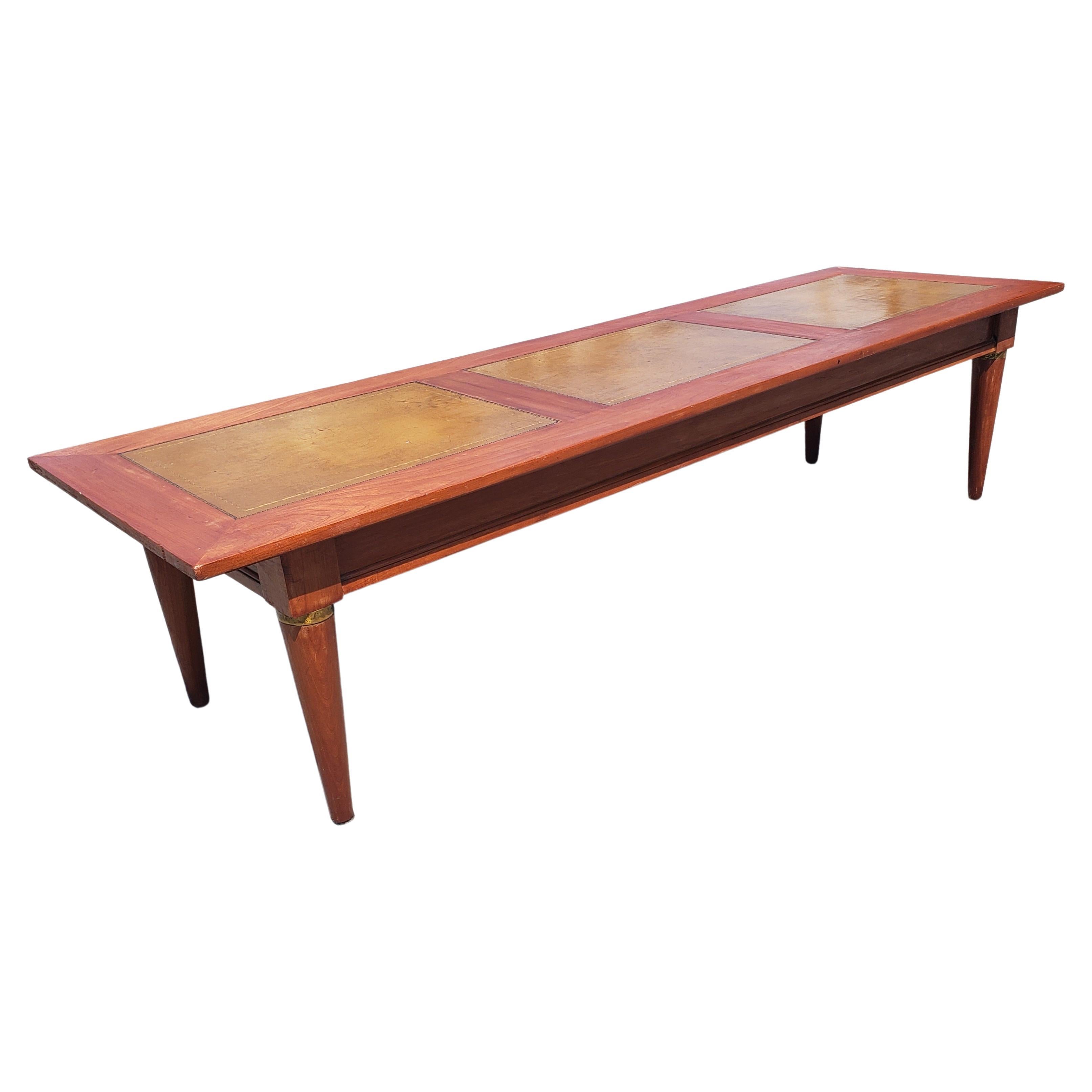 Beautiful long solid cherry with leather top coffee table , cocktail table in good condition. 
Measures 60 inches in width, 18 inches in depth and stands 18 inches tall.