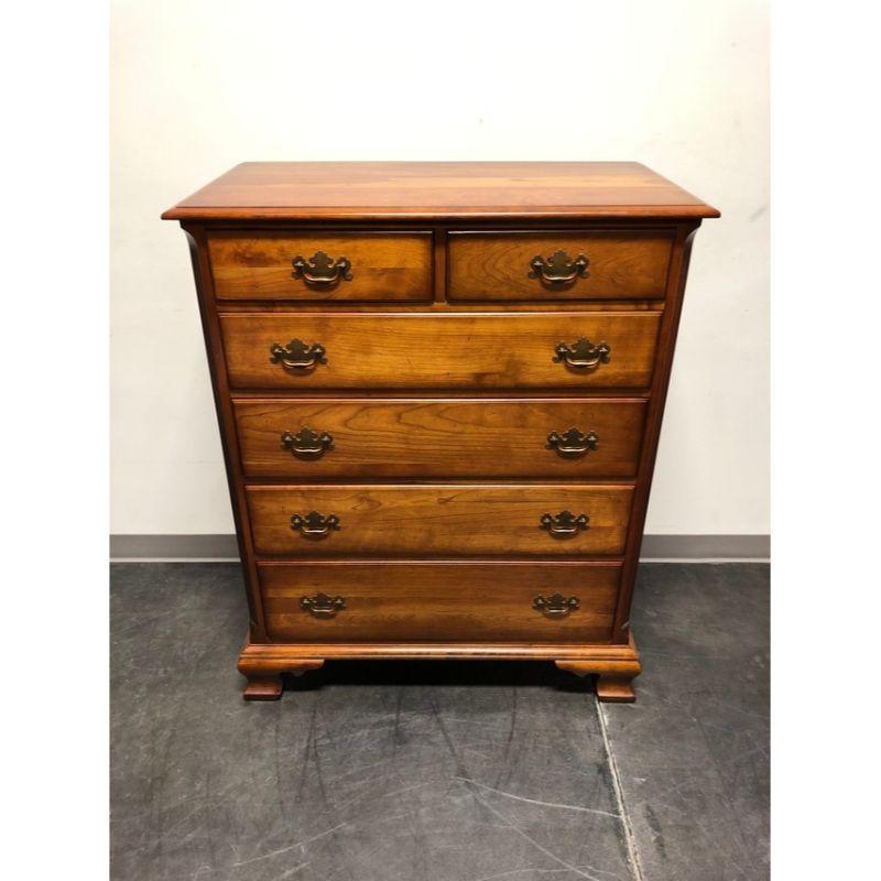 A vintage chest of drawers in the Chippendale style by Cherry Hill Collection. Solid cherry with brass hardware, fluted columns and ogee bracket feet. Features six drawers of dovetail construction. Made in the USA, in the mid 20th