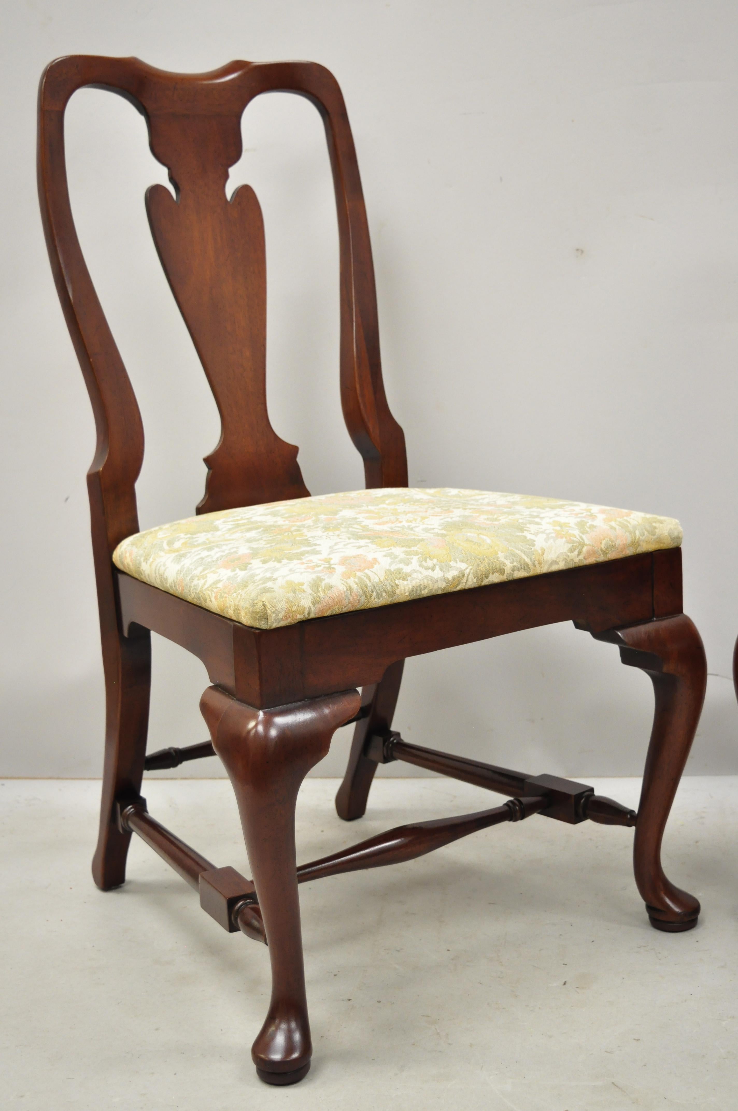 Vintage solid cherrywood queen Anne style stretcher base dining side chairs. Item features solid wood construction, beautiful wood grain, shapely queen Anne legs, quality American craftsmanship,
circa mid-late 20th century. Measurements: 38