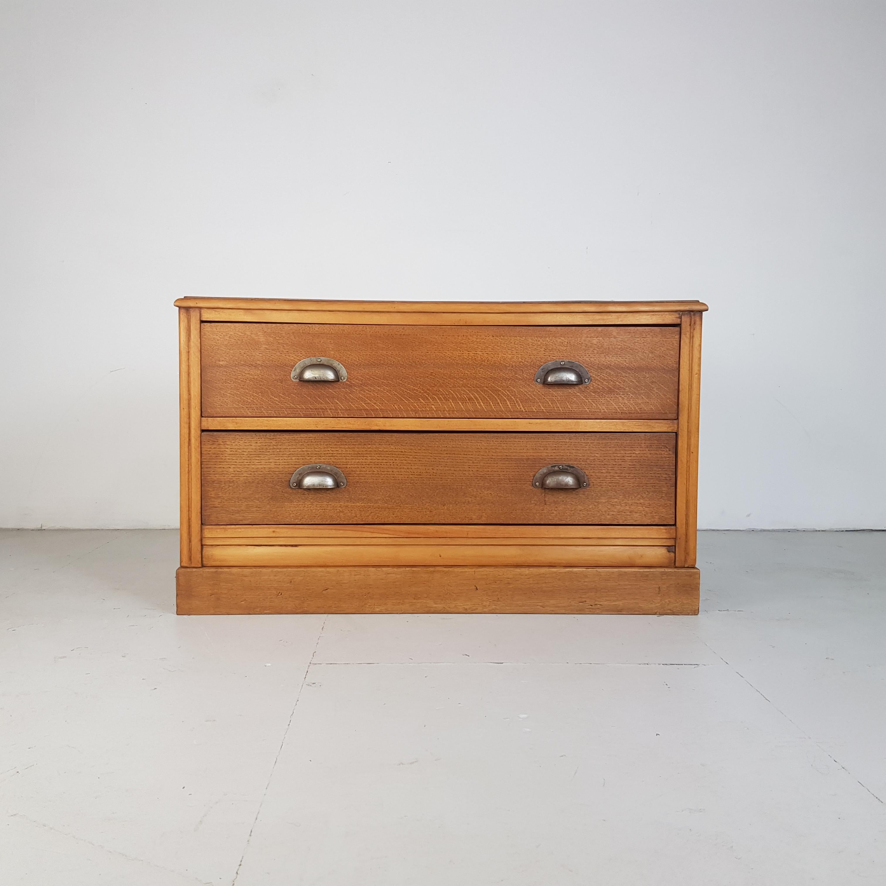 Lovely 1950s haberdashery style chest of drawers.

Offers lots of storage with 2 good deep drawers with dovetail joints.

In good vintage condition. Some scuffs and nicks here and there, but nothing that detracts. 

This item has been lightly