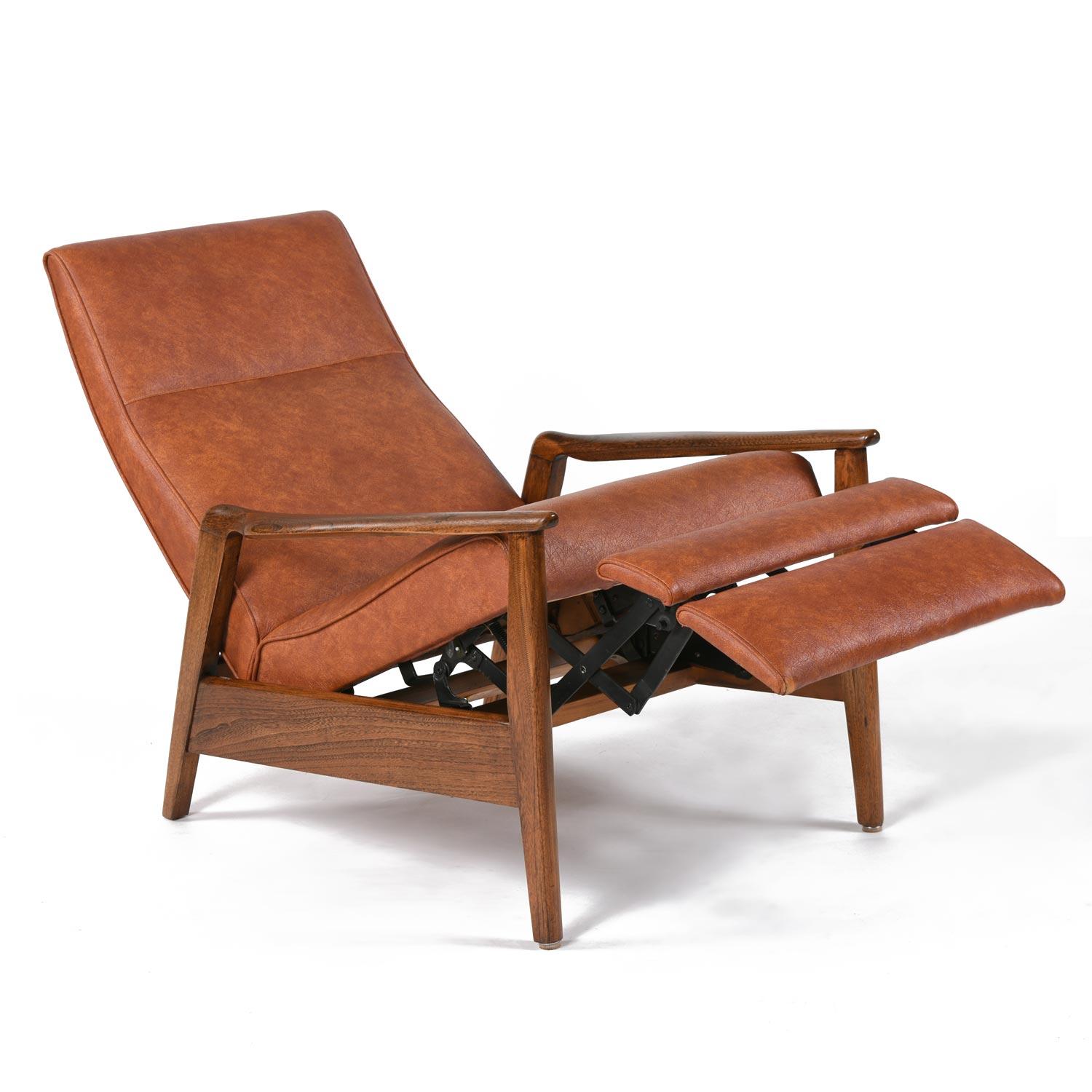 Super stylish Mid-Century Modern recliner by Home Chair Co. of Ronda, North Carolina. The Milo Baughman style recliner has a blade-like back and solid oak frame. Durability and beauty were hallmarks of American 20th Century design. While the Danish