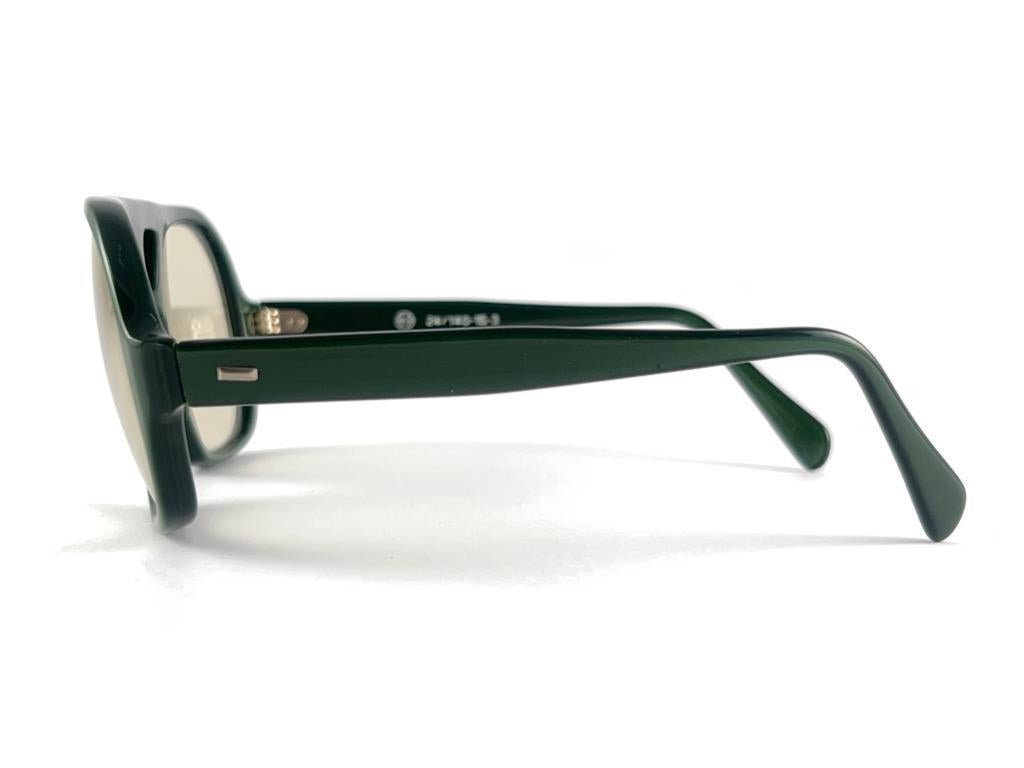 Women's or Men's Vintage Solid Photo Matic Olive Green Frame Light Lens 70'S Sunglasses For Sale