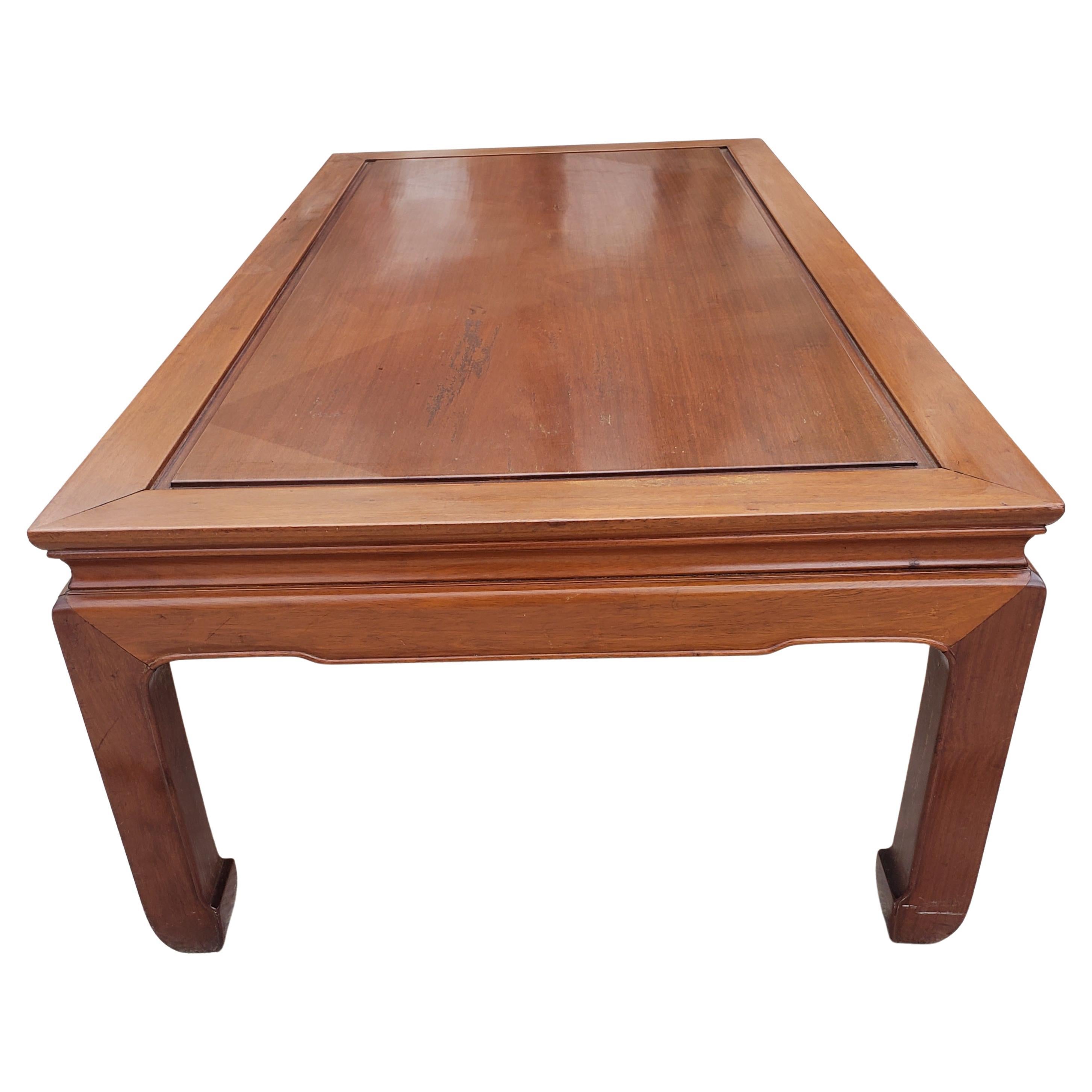Solid rosewood in Ming style coffee table. Simple clean lines, Asian key design on the edges. Hand-applied natural rosewood finish enhances the beauty of the wood grains. This amazing table is made in the 50s era. It's all hand-built with Chinese