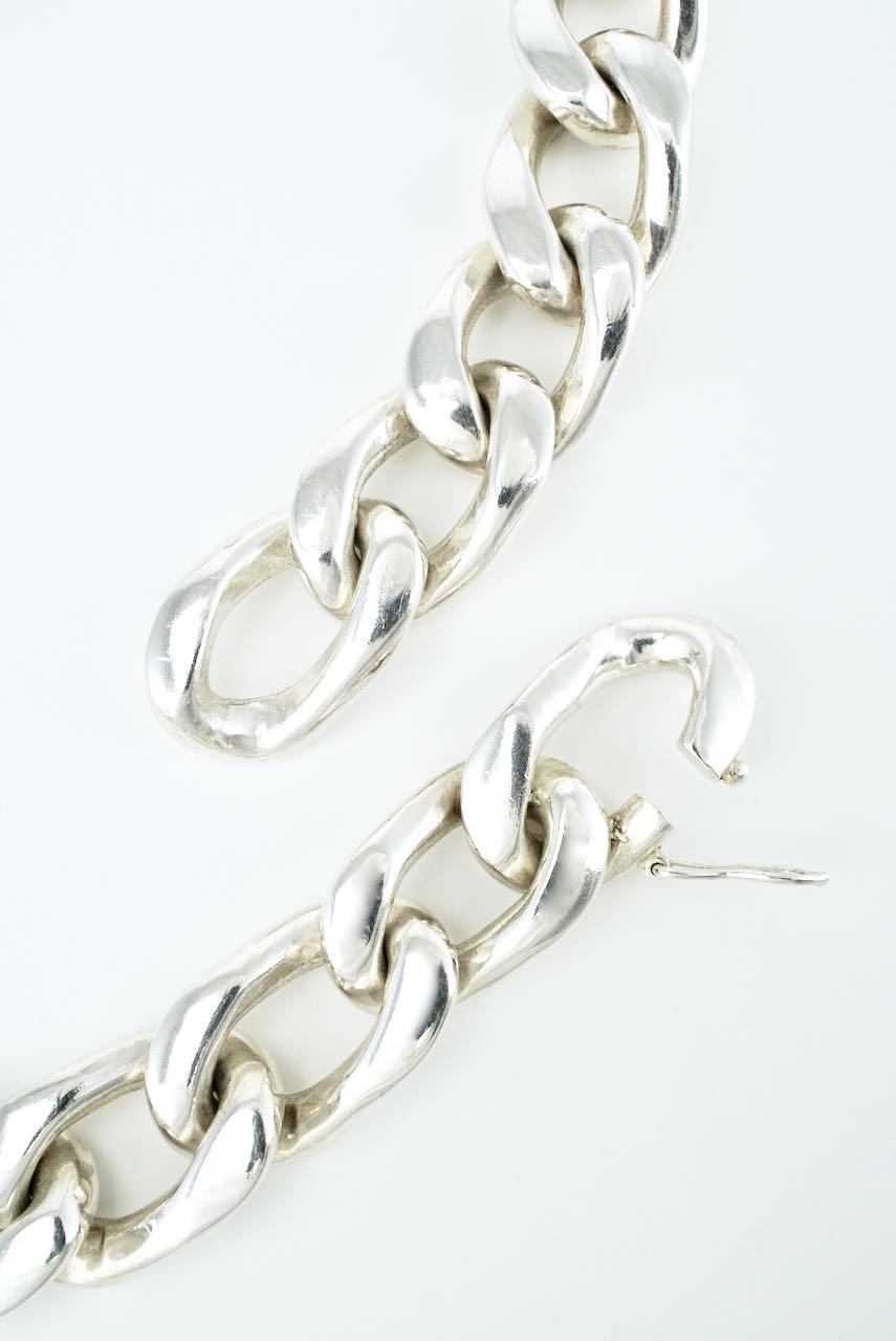 A solid silver Cuban curb link necklace of 27 open links with an integrated clasp with figure of eight closure - a great statement necklace that can be worn for a great casual rockstar look or a dramatic formal event - unmarked but tested by x-ray