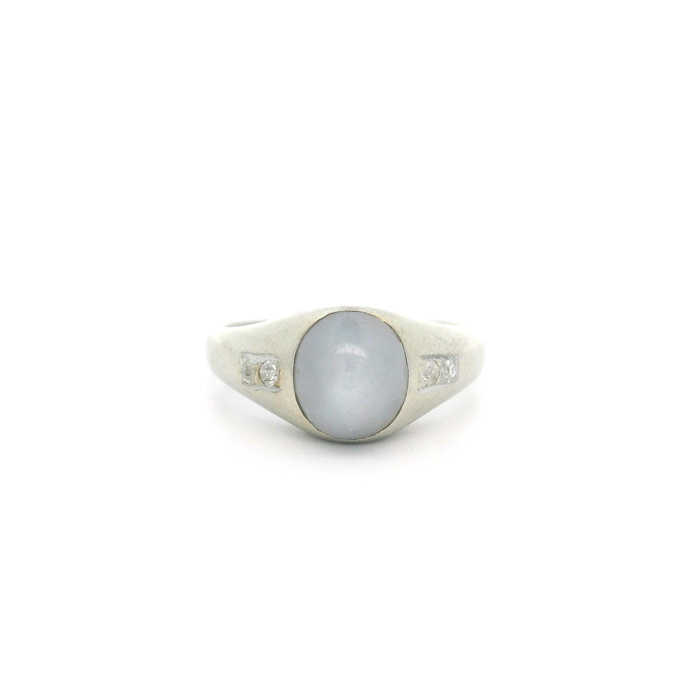 --Stone(s):--
(1) Natural Genuine Star Sapphire - Oval Cabochon Cut - Bezel Set - Grayish Blue Color - Nice Star - 7.5x6.5 - 2.5ct (approx.)
(4) Natural Genuine Diamonds - Chunky Old Cut - Pave Set - Nice White Color - 0.08ctw (approx.)
Total Carat