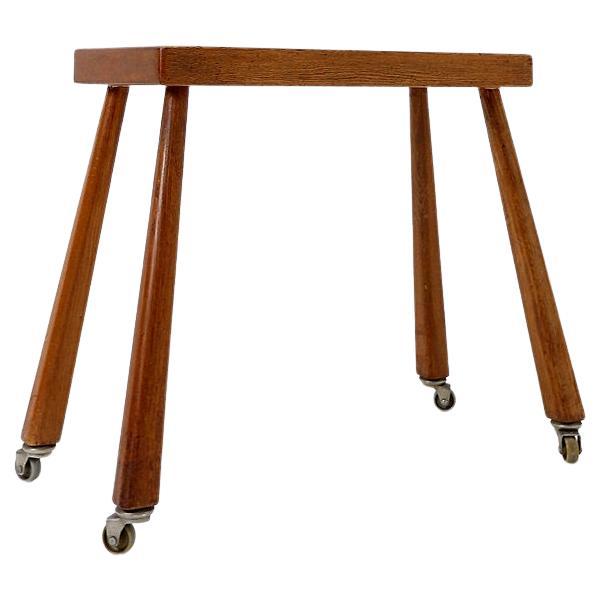 Vintage solid wood side table on casters - 1960s