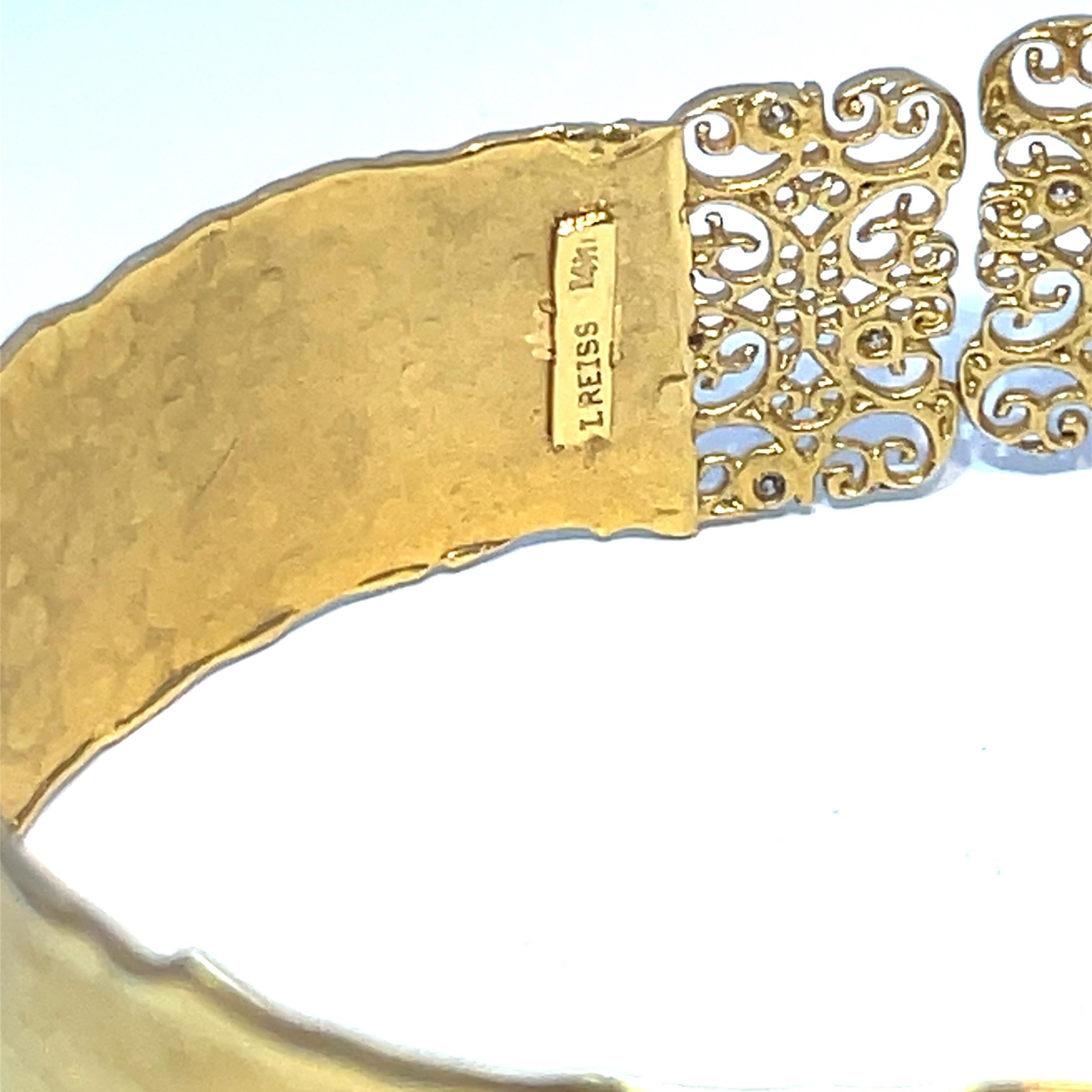 Elevate your accessory game with this stunning 14k Yellow Gold Cuff Bracelet from I REISS, a brand celebrated for its exquisite handcrafted jewelry. Featuring a delicate filigree design and a hand-hammered finish, this bracelet exudes elegance and