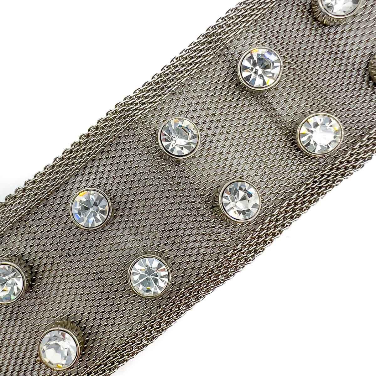 A stunning party piece with this Vintage Solitaire Strap Bracelet. Huge crystals set in mesh provide the ultimate glam yet edgy vibe.

An unsigned beauty. A rare treasure. Just because a jewel doesn’t carry a designer name, doesn’t mean it isn't