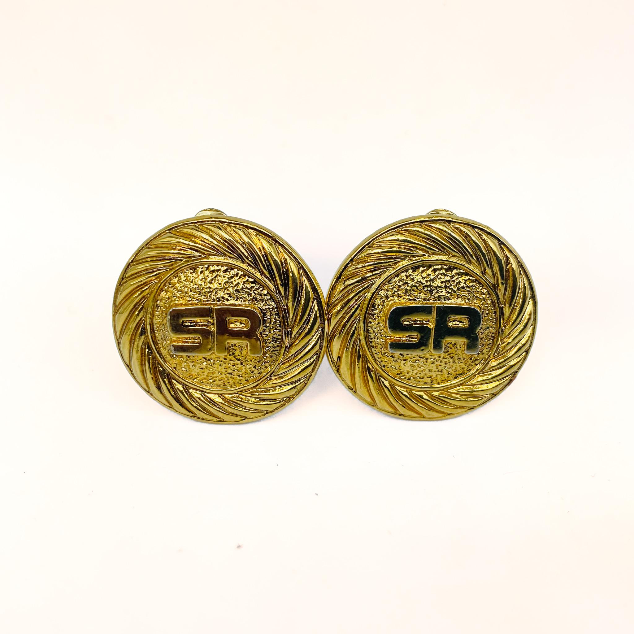 Vintage Sonia Rykiel Earrings 1980s

Timeless 1980s gold plated clip on earrings from Sonia Rykiel.

Sonia Rykiel, dubbed 'Queen of Knitwear', is best known for liberating women from restrictive clothing in the 1960s - 1980s and contributing to the
