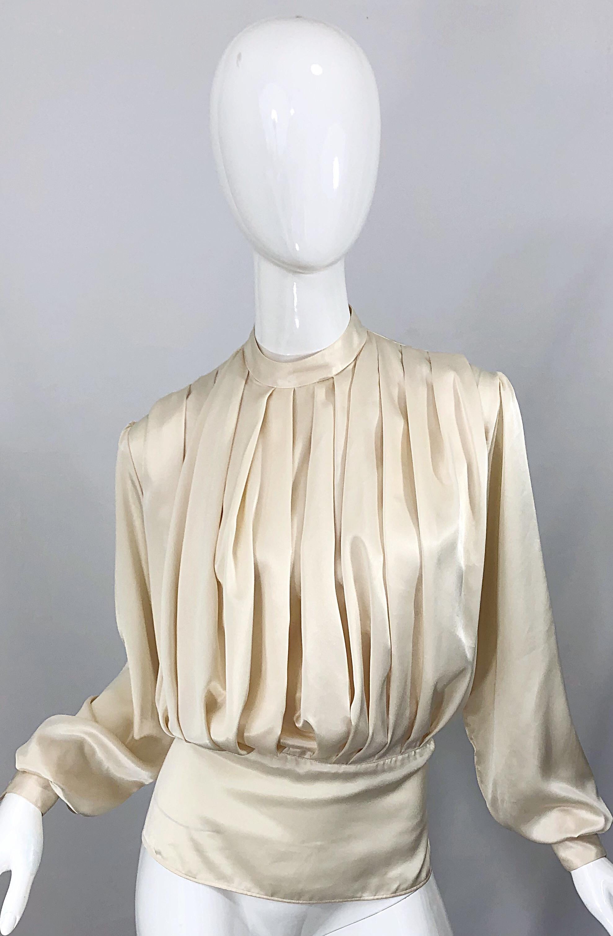 Chic vintage 1990s SONIA RYKIEL ivory / off-white pleated silk blouse! Feature the softest most luxurious silk, with a flattering and forgiving silhouette. Pleats on the front with a high neck. Button closure at top back neck with a peek-a-boo.