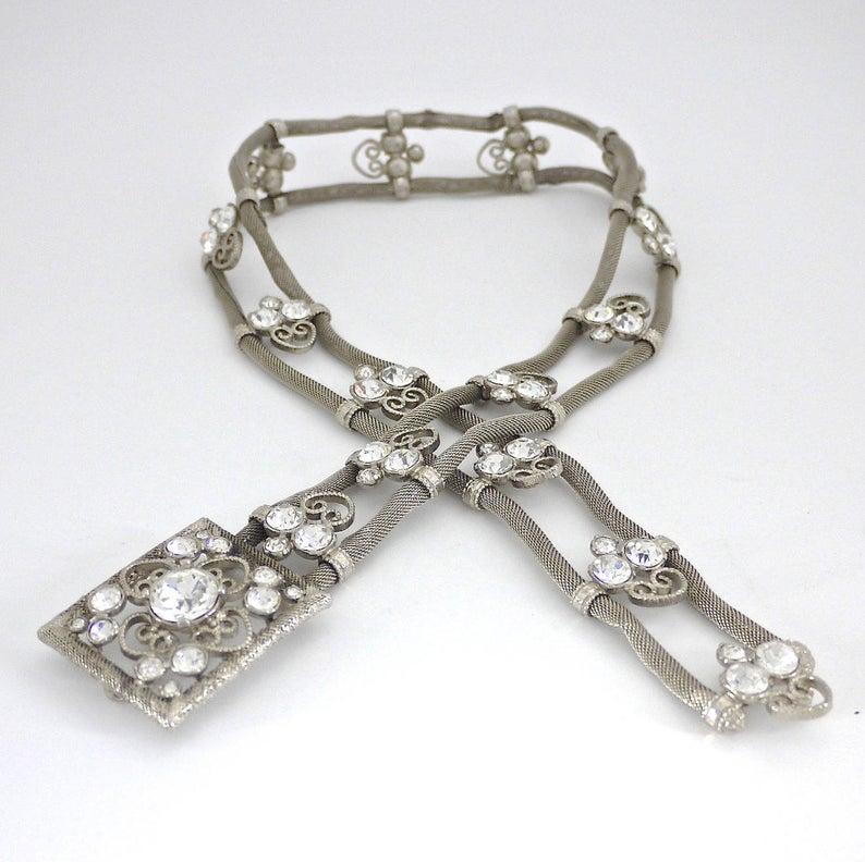Vintage SONIA RYKIEL Mesh Filigree Rhinestone Art Deco Belt

Measurements:
Buckle Height: 1.65 inches (4.2 cm)
Buckle Width: 1.89 inches (4.8 cm)
Belt Height: 1.22 inches (3.1 cm)
Length: 28.74 inches (73 cm)

Features:
- 100% Authentic SONIA