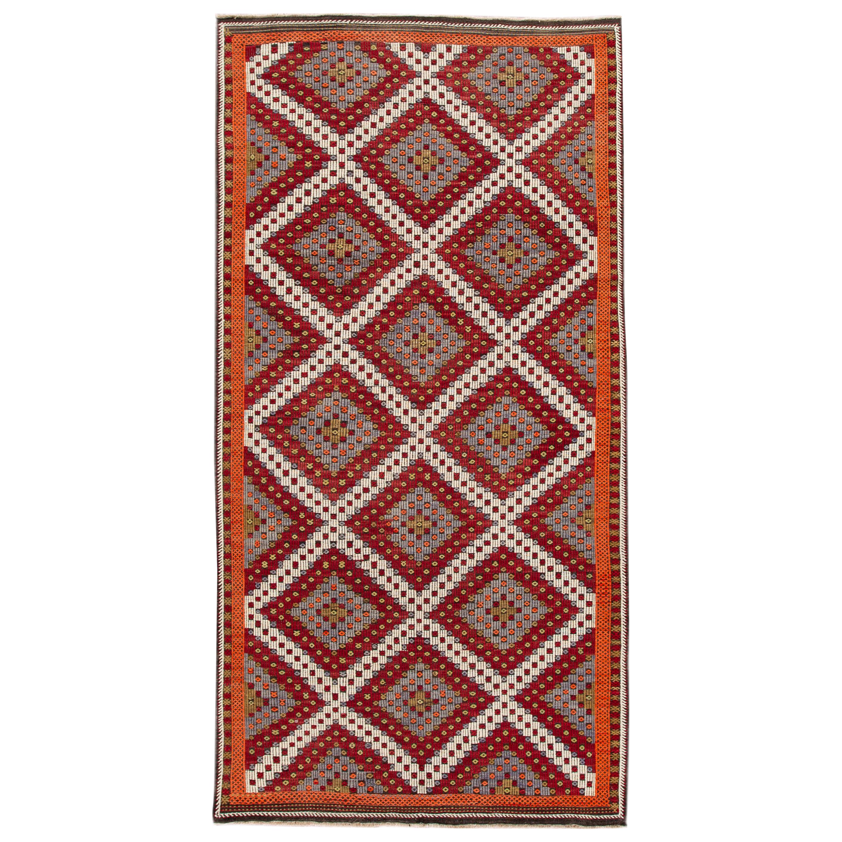 Beautiful vintage Turkish flat-weave Soumak hand knotted wool rug with a multi-color field and accents in all-over geometric design,

This rug measures 6' 1
