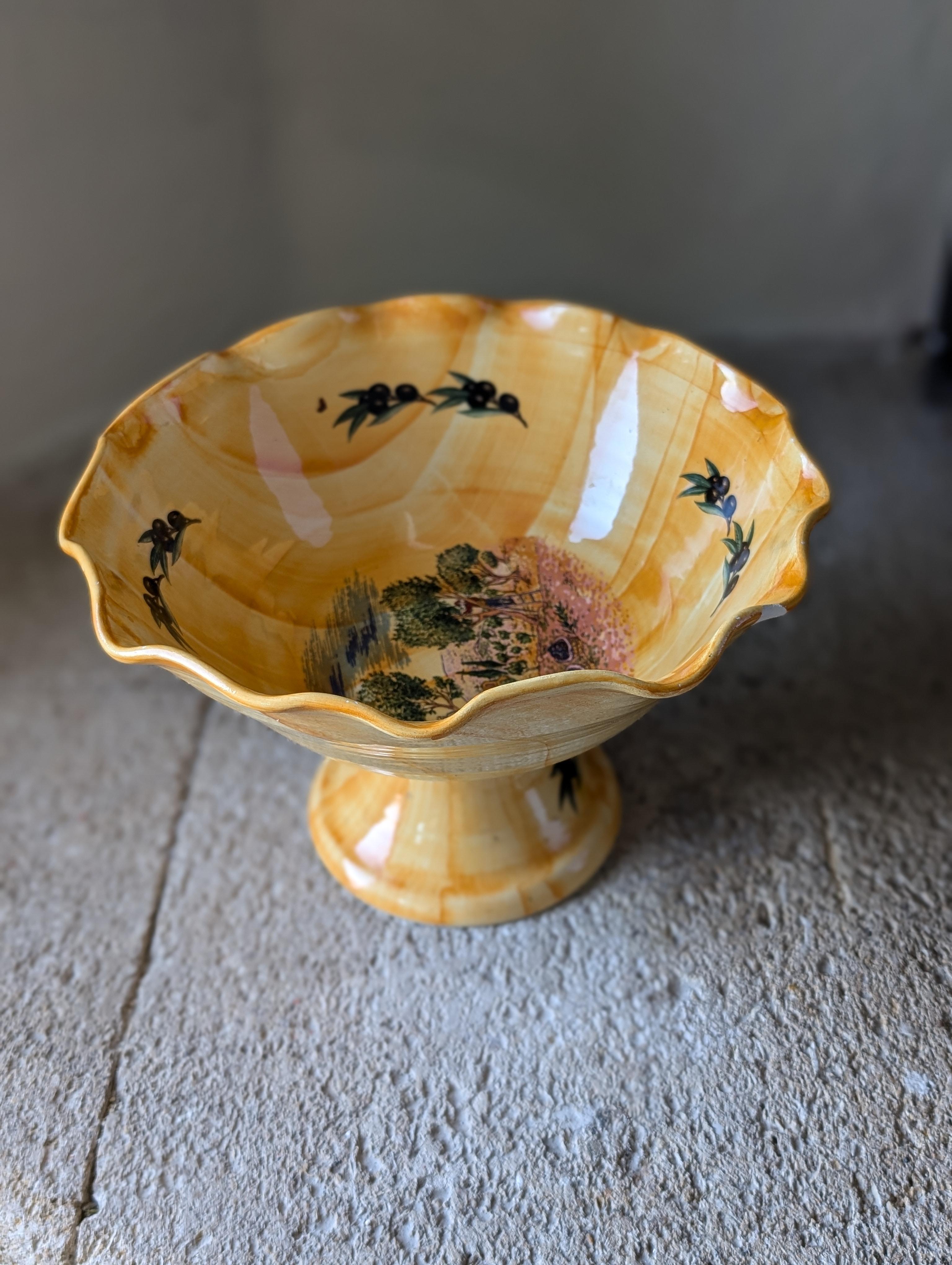 Introducing a charming vintage South of France-themed fruit stand, a delightful piece that brings the rustic elegance and vibrant spirit of the French countryside into your home. This beautifully crafted fruit stand features intricate detailing and