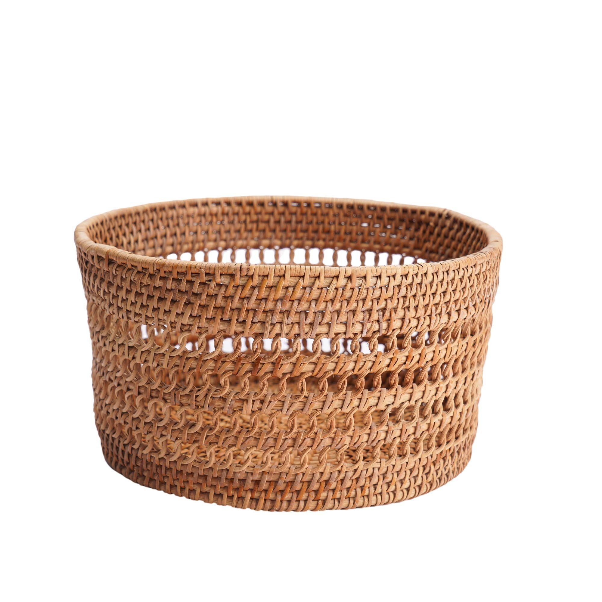 Woven split bamboo and rattan cylinder form basket. The rattan is coiled in six rows and lashed together with bamboo at the rim of the basket and three rows at the bottom of the basket. Between are three single coils of rattan joined by continuous