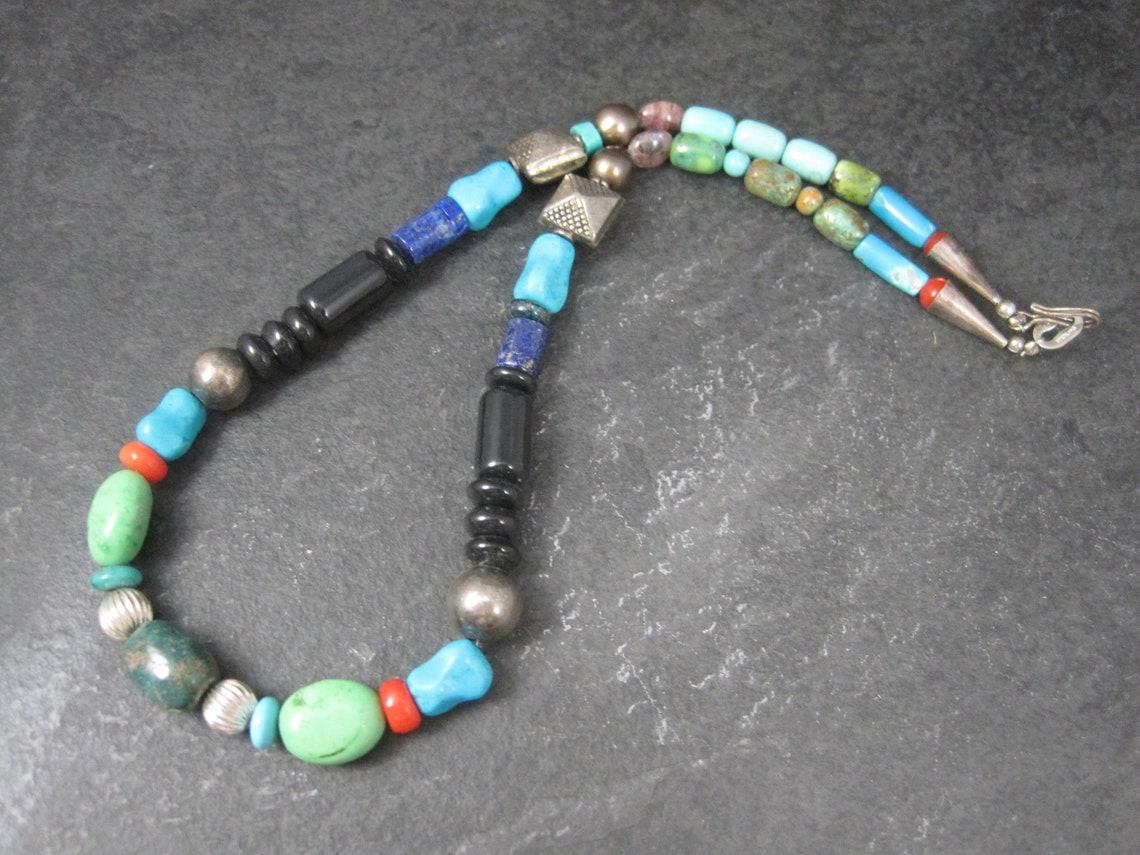 This gorgeous southwestern necklace features natural hand carved gemstone and sterling beads.
The silver beads, end caps and clasp are all sterling silver.

At its widest, this necklace measures 11mm.
The necklace is 16 inches from end to