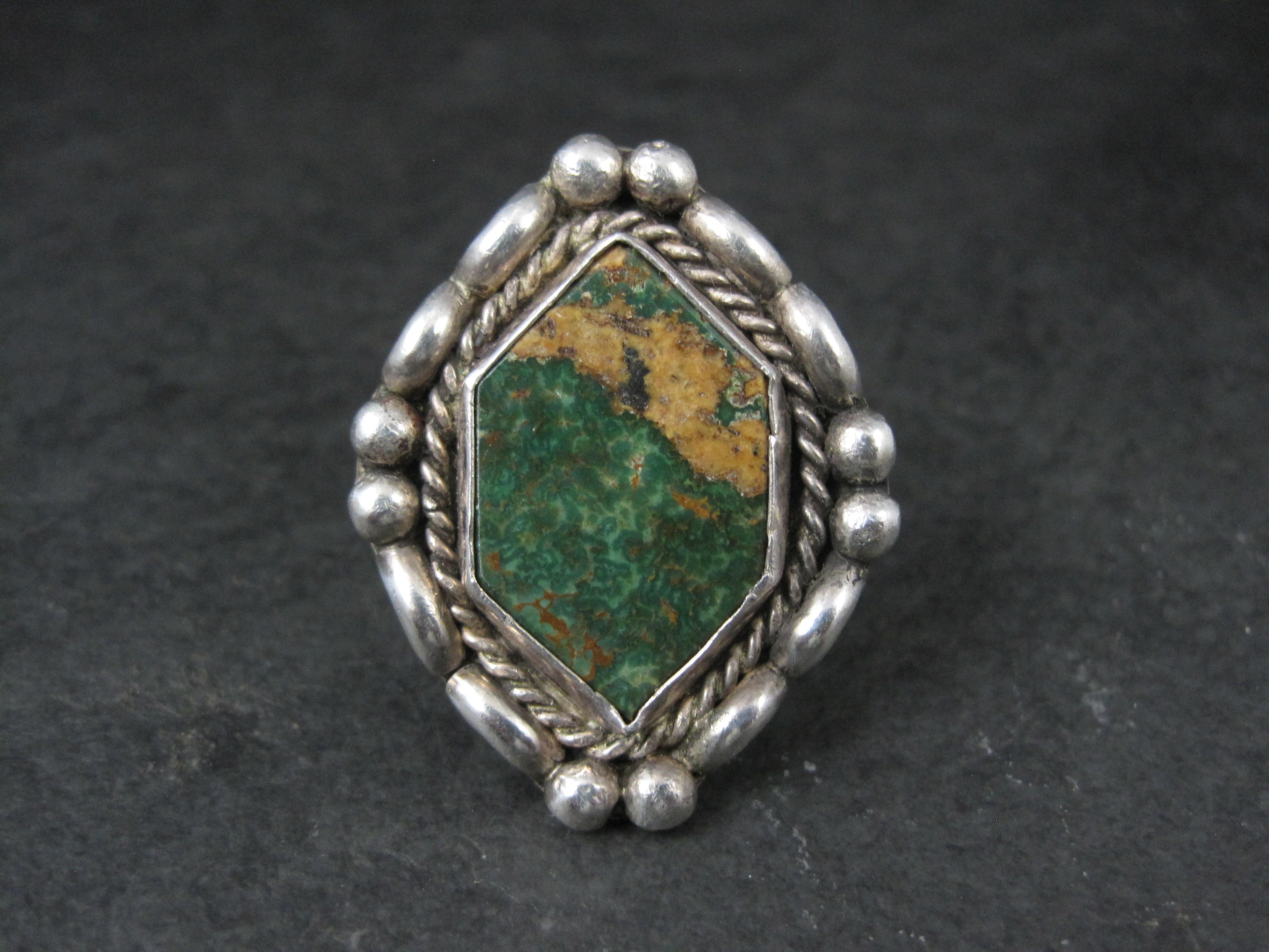 This gorgeous Southwestern ring is sterling silver with a Kings Manassa turquoise gemstone.
The face of this ring measures 1 1/8 inches east to west and 1 7/16 inches north to south.
Size: 8 1/2
Marks: None
Condition: Excellent