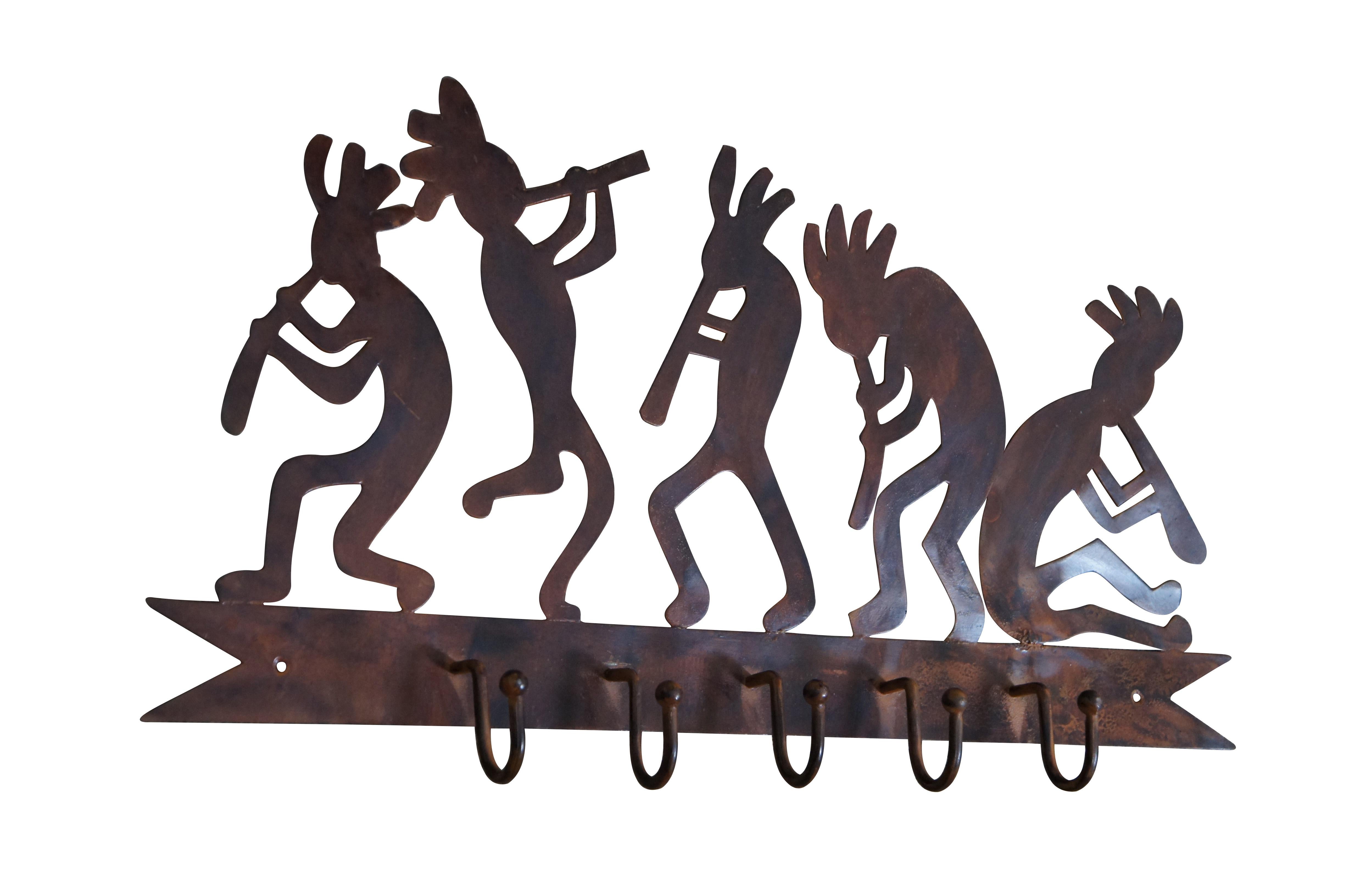 Vintage Southwestern Kokopelli five hook coat or hat rack featuring the classic ancient Indian legend of the hunchback flute player who was a teacher, healer and storyteller; and giver of good fortune and fertility.

Dimensions:
24