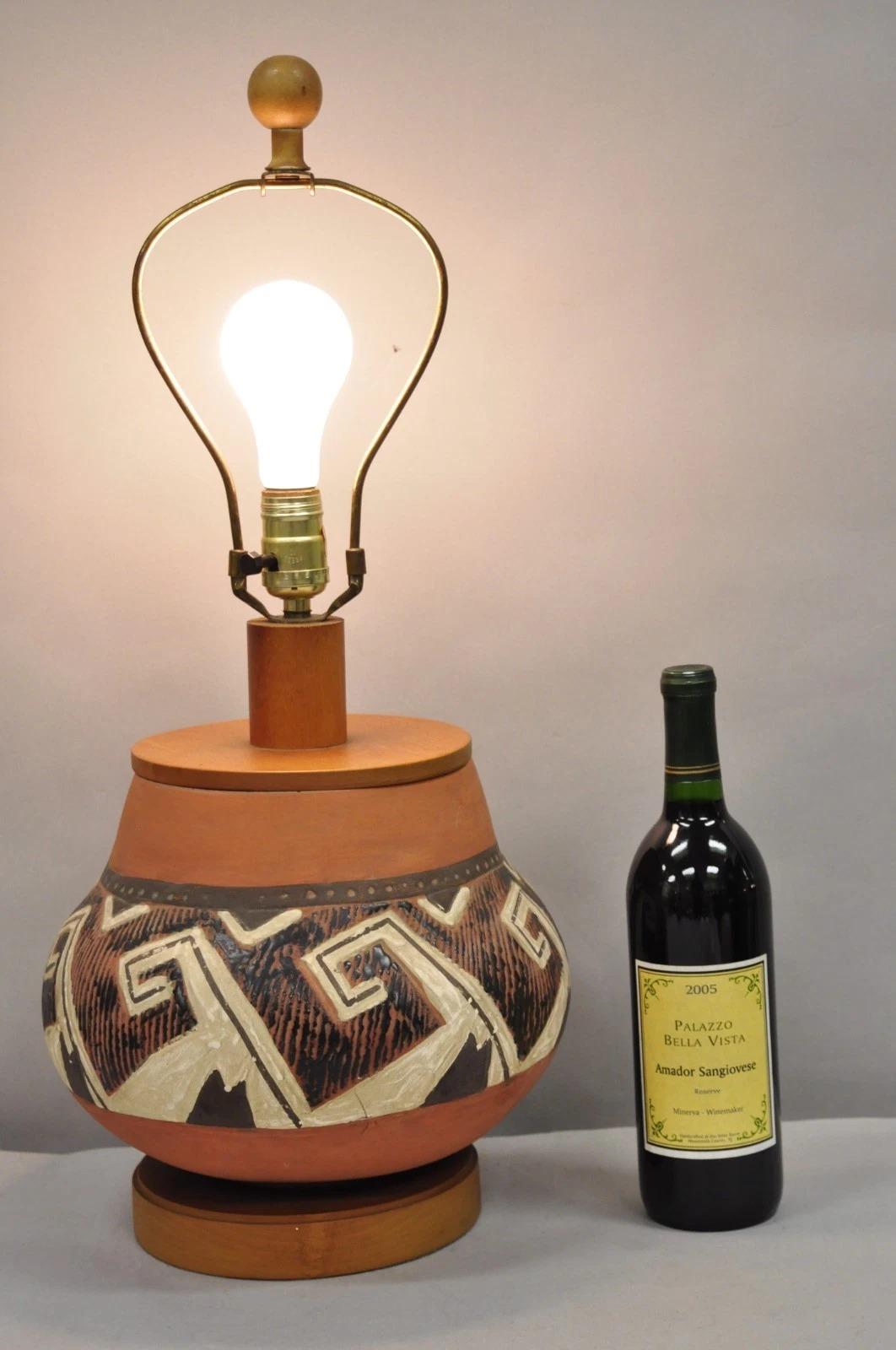 Vintage Southwestern Native American Terracotta Pottery Vase Table Lamps with Wooden Mounts - a Pair. Circa Late 20th Century. Measurements: 24