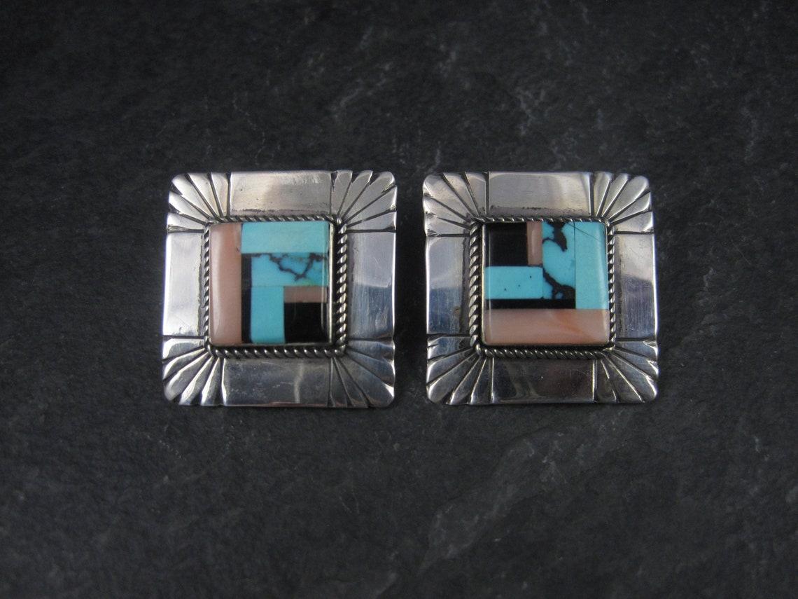 These gorgeous clip on earrings are sterling silver with genuine stone inlay.

Measurements: 1 3/8 inches corner to corner - 1 inch side to side
Weight: 11.2 grams

Marks: None

Condition: Excellent