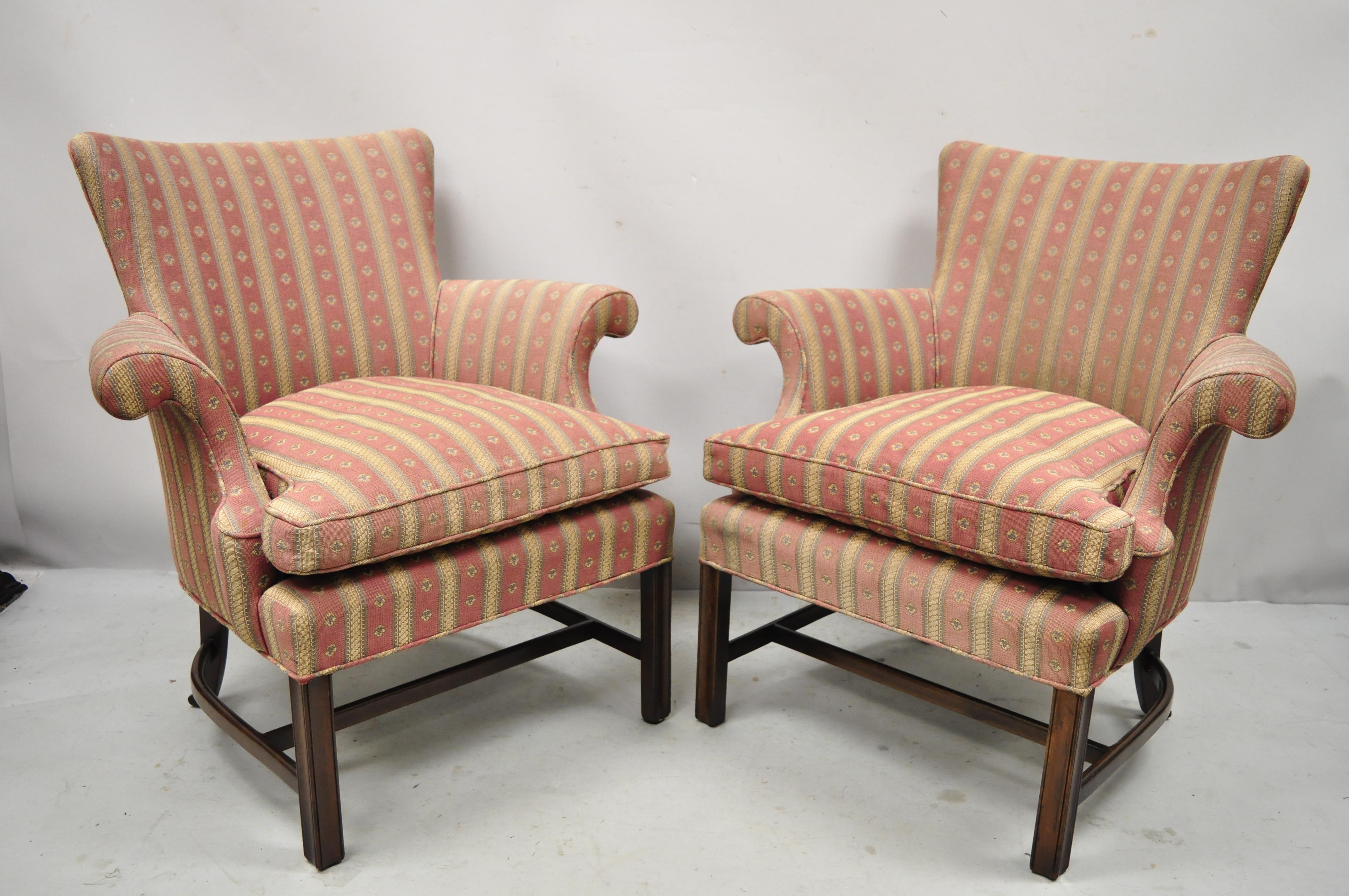 Vintage Southwood mahogany upholstered Chippendale lounge club chairs - a pair. Item features rolled arms, bentwood stretcher base, loose cushion, solid wood frames, quality American craftsmanship great style and form. Circa mid to late 20th