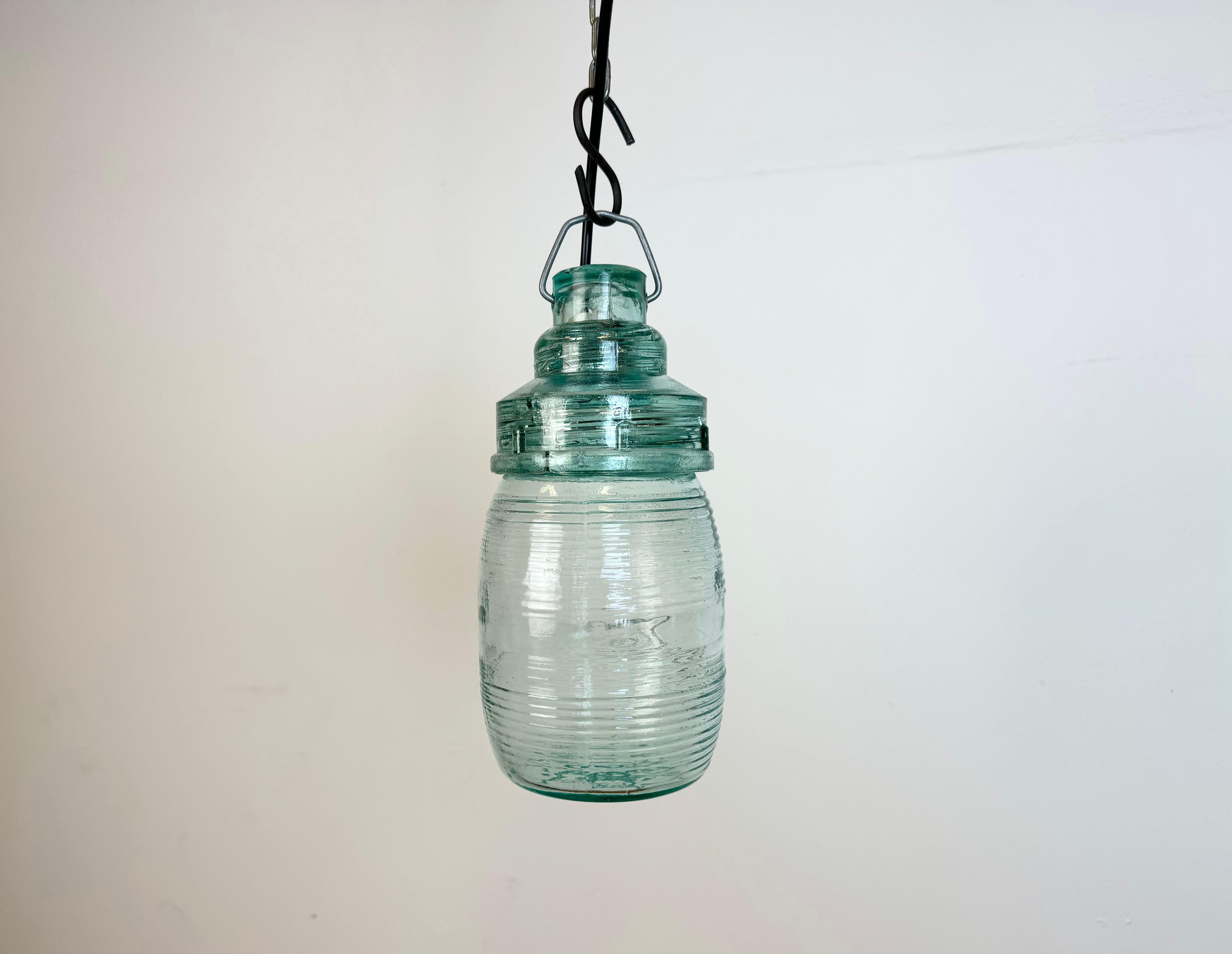 Vintage industrial completely glass light made in Ukraine in former Soviet Union during the 1960s. The socket requires E27/ E26 light bulbs. New wire. The weight of the light is 0,9 kg.
