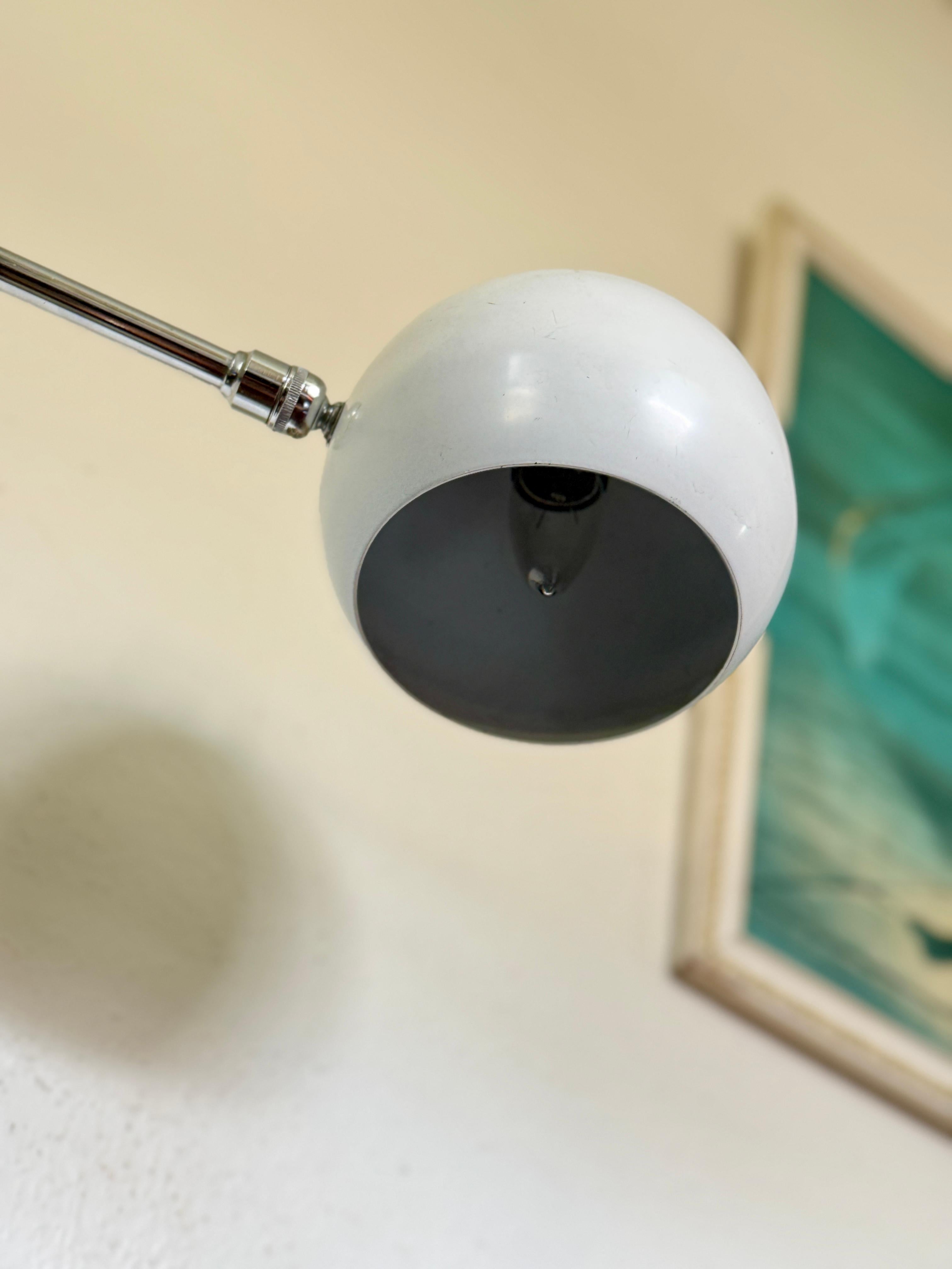 Vintage space age adjustable chrome floor lamp with white accents, circa 1970s In Good Condition For Sale In Houston, TX