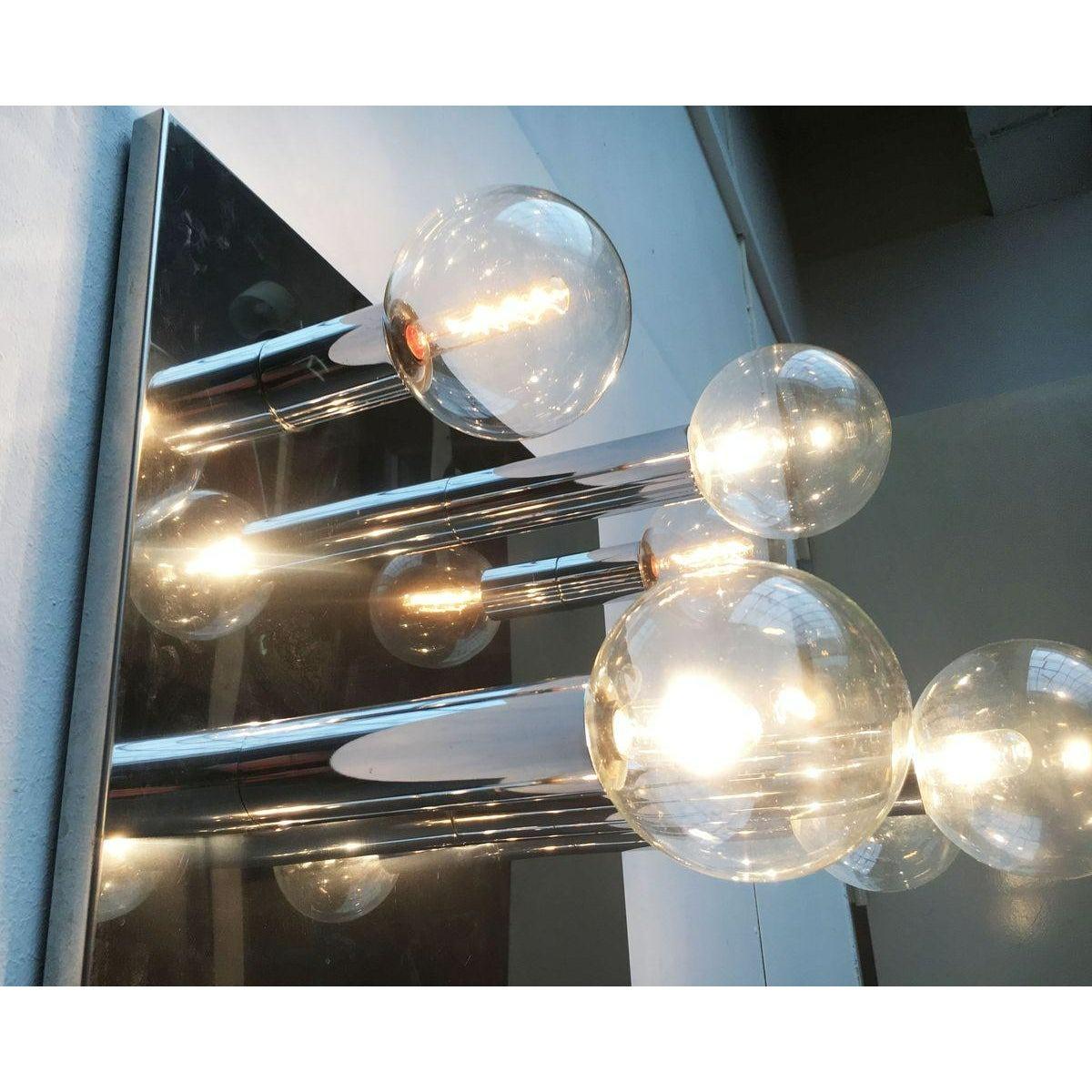 Imposing mid-century ceiling or wall lamps from the house of staff after a design by japanese designer motoko ishii. this design convinces with its reflective surfaces. The play with reflections creates a special depth. The reflective surfaces