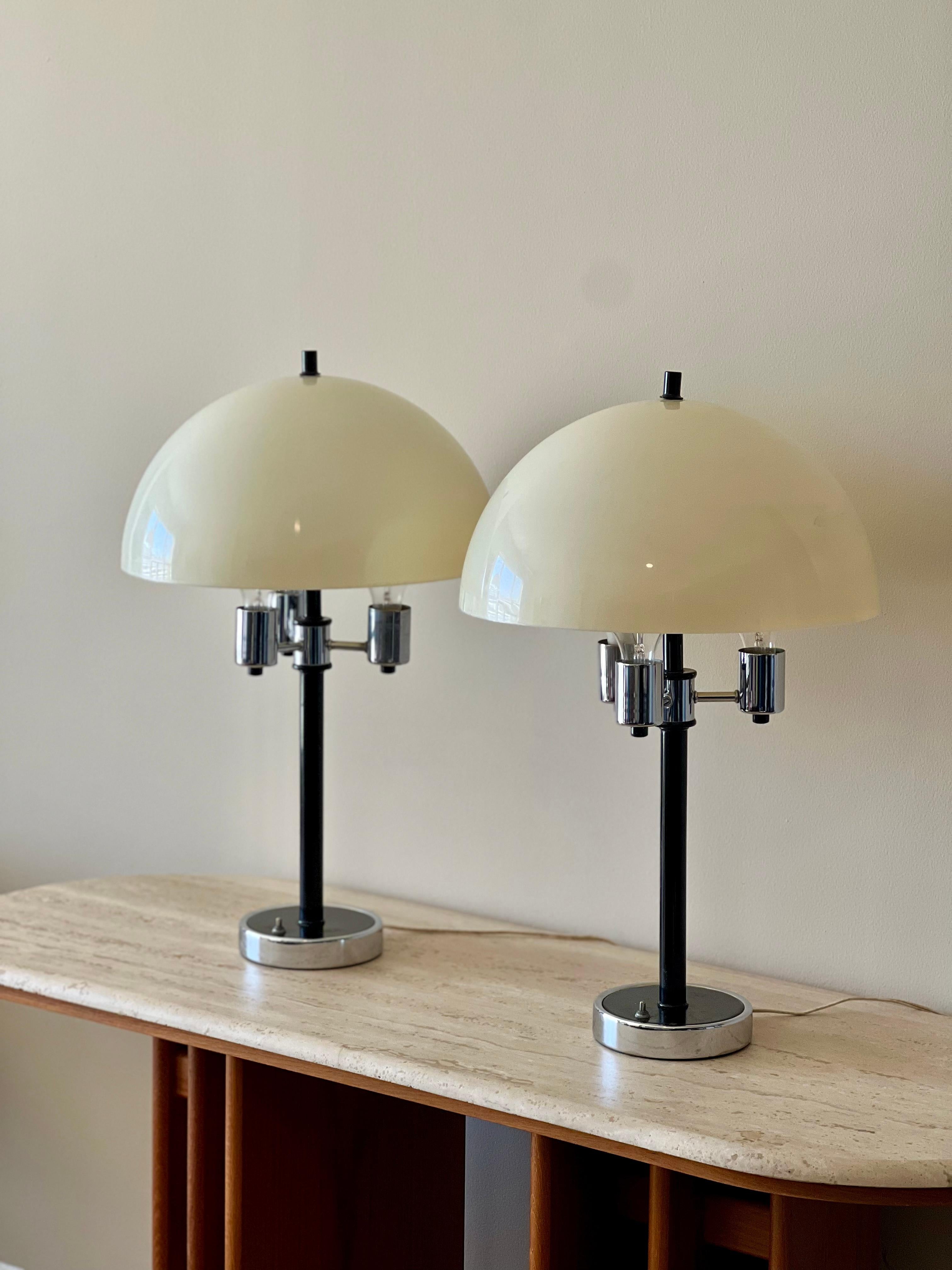 In the style of Verner Panton and Guzzini amongst many others. Beautiful cream acrylic shades and chrome bases. Nice vintage condition with a some scuffing and chipping to the base.
