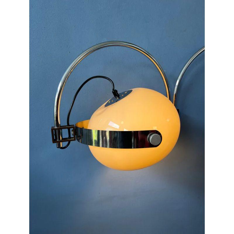 Oft-sought after vintage double arc space age wall lamp by Dijkstra with mushroom shade. The mocca-coloured mushroom shade produces a warm, cosy light. The inner arc can be positioned aligned with or opposed to the main arc. The lamp requires an E27