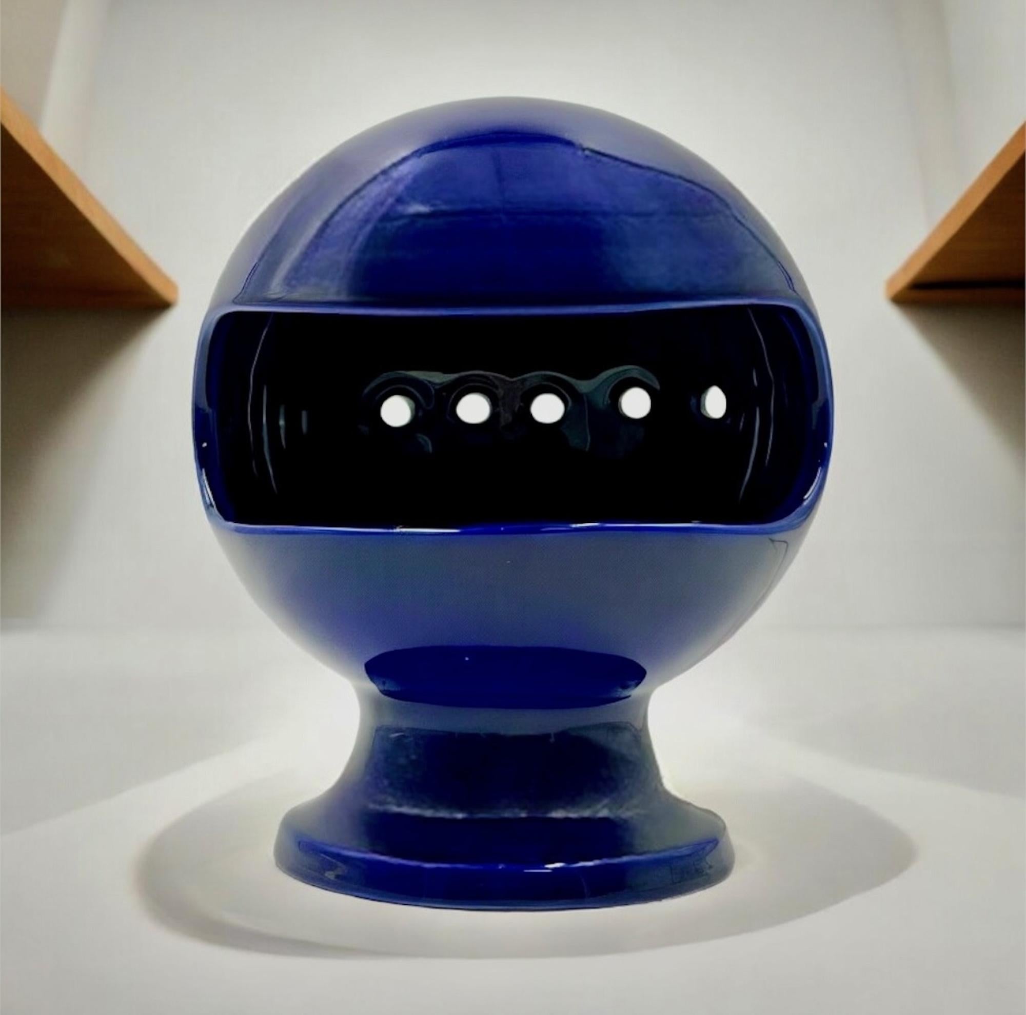 Iconic space age lamp from renowned Italian designer Enzo Bioli crafted by ‘Il Picchio’, Italy in the 1960s.

This particular lamp exemplifies the exquisite craftsmanship of the era. Made from blue glazed ceramic, this piece hails from the 1960s and