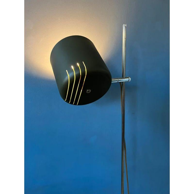 A very special and rare space age floorlamp by Anvia in dark green/gray colour. The light escapes beautifully through the rostered metal shade. The lamp requires one E27 lightbulb and currently has a EU-plug.

Dimensions:
ø Shades: 14 cm
Length