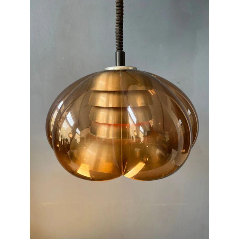 Classic space age pendant light by Herda in a flower-like shape. The lamp consists of a transparent outer shade and aluminium inner shader. The lamp requires one E27 (standard) lightbulb.

Dimensions: 
ø Shade: 45 cm
Height (shade): 33