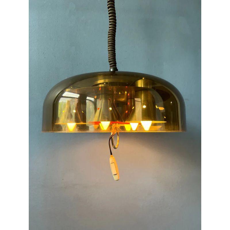 Beautiful space age pendant light by the Dutch brand Herda with acrylic glass shade. The lamp has an acrylic outer shade and a steel inner shade. The lamp requires 6 E14 lightbulbs.

Dimensions:
ø: 39 cm
Height (shade): 25

Condition: Good.