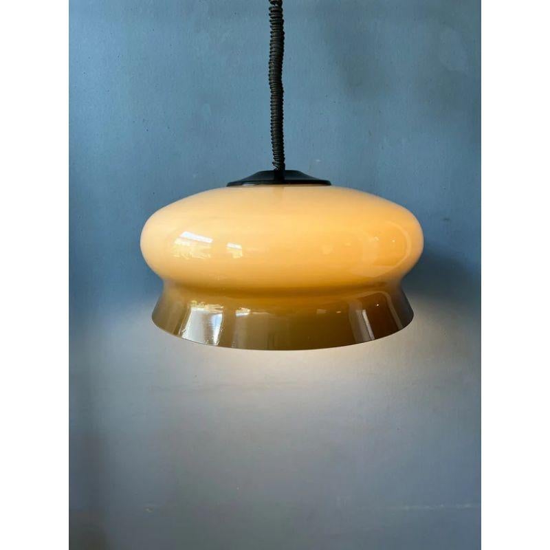 A nice mushroom pendant lamp by Herda in space age style. The acrylic shades produces a warm, cosy light. The height can easily be adjusted with the rise-and-fall mechanism. The lamp requires one E27 lightbulb.

Dimensions
ø (with chrome frame):