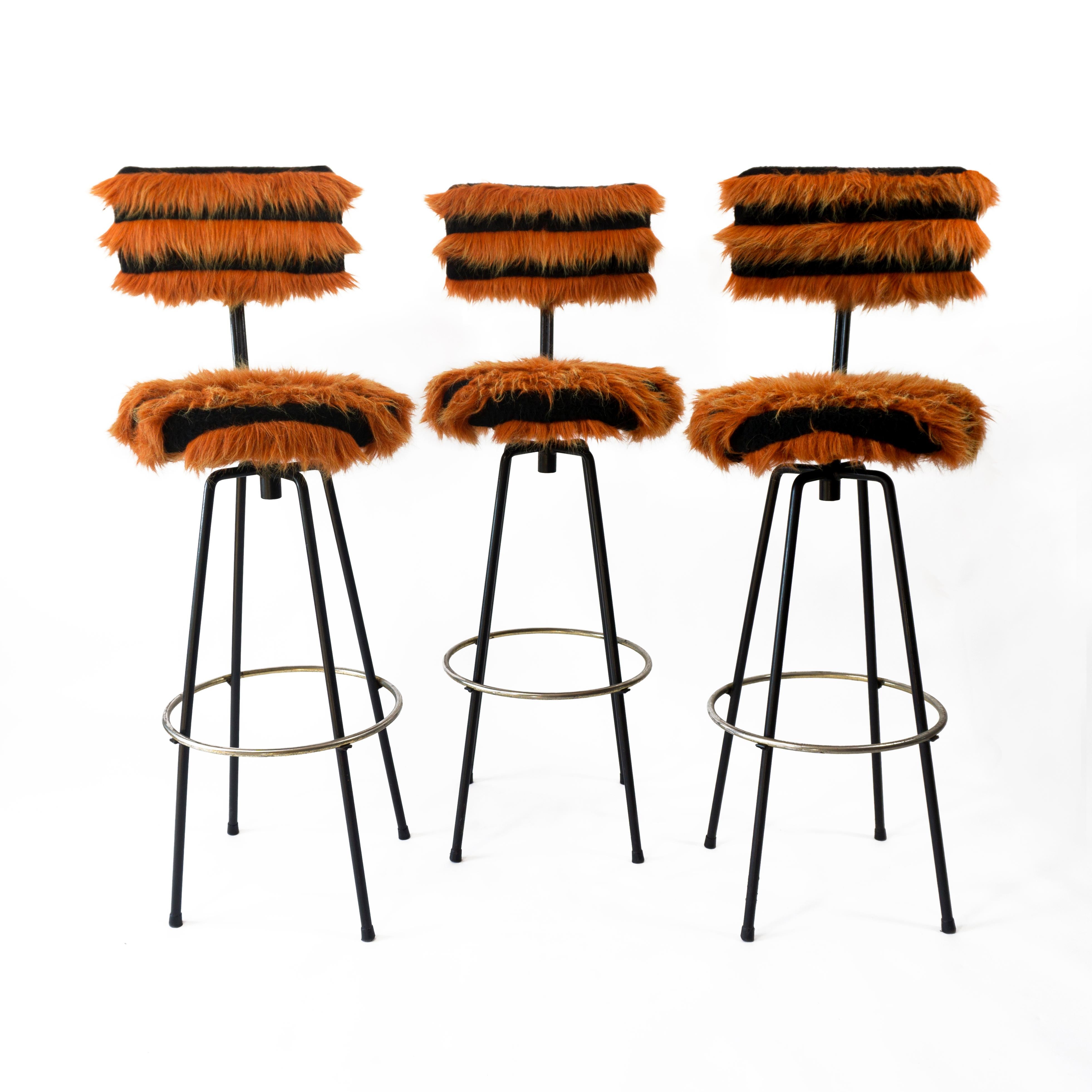 Fantastic set of 3 bar stools originaly designed by Herta-Maria Witzemann and manufactured by Erwin Behr, Germany 1950. However the chairs were upholstered in the 1970s with a funky orange and black plush fabric - according to the previous owner,